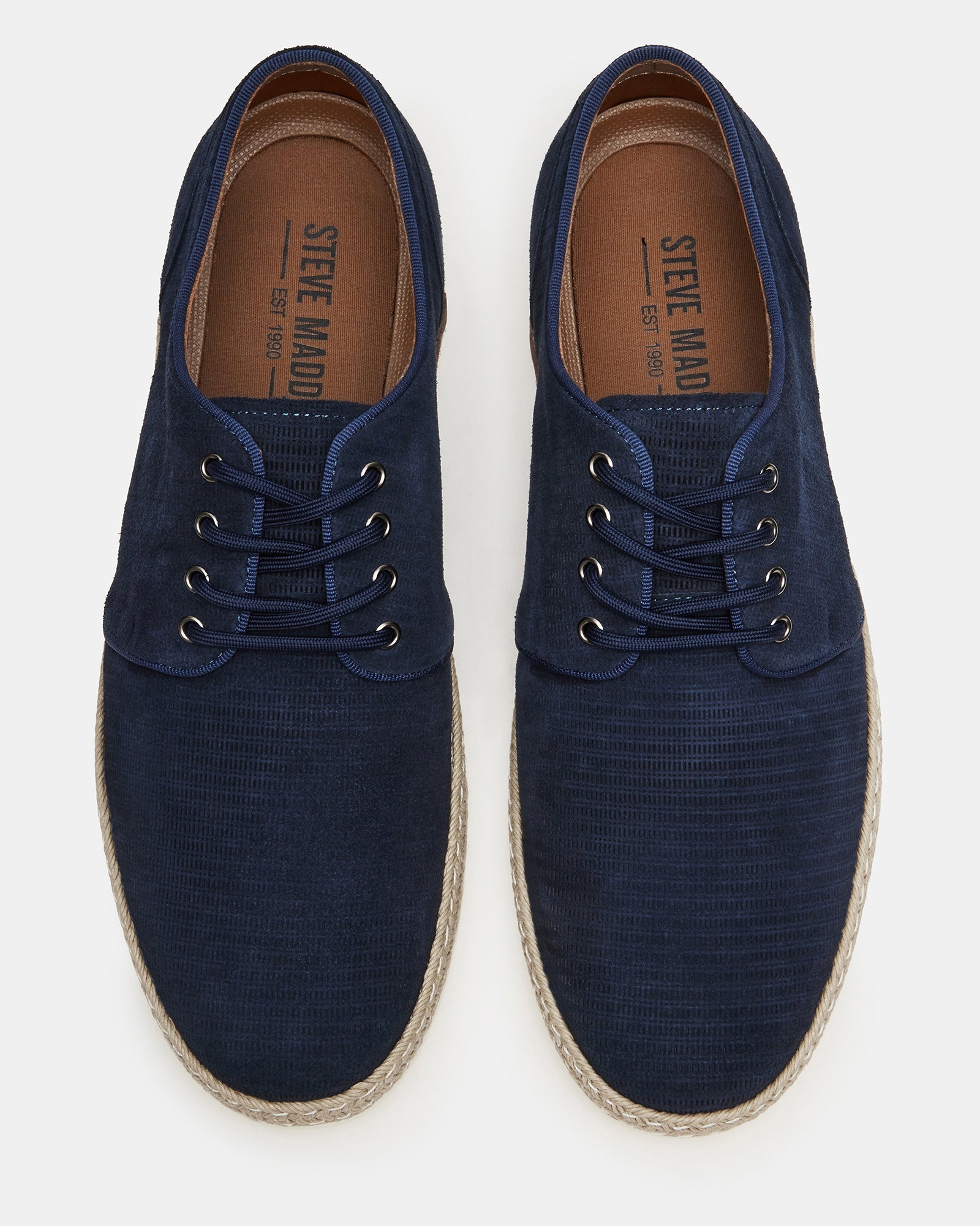 Menorca Navy suede shoes showcasing the lace-up front and textured surface