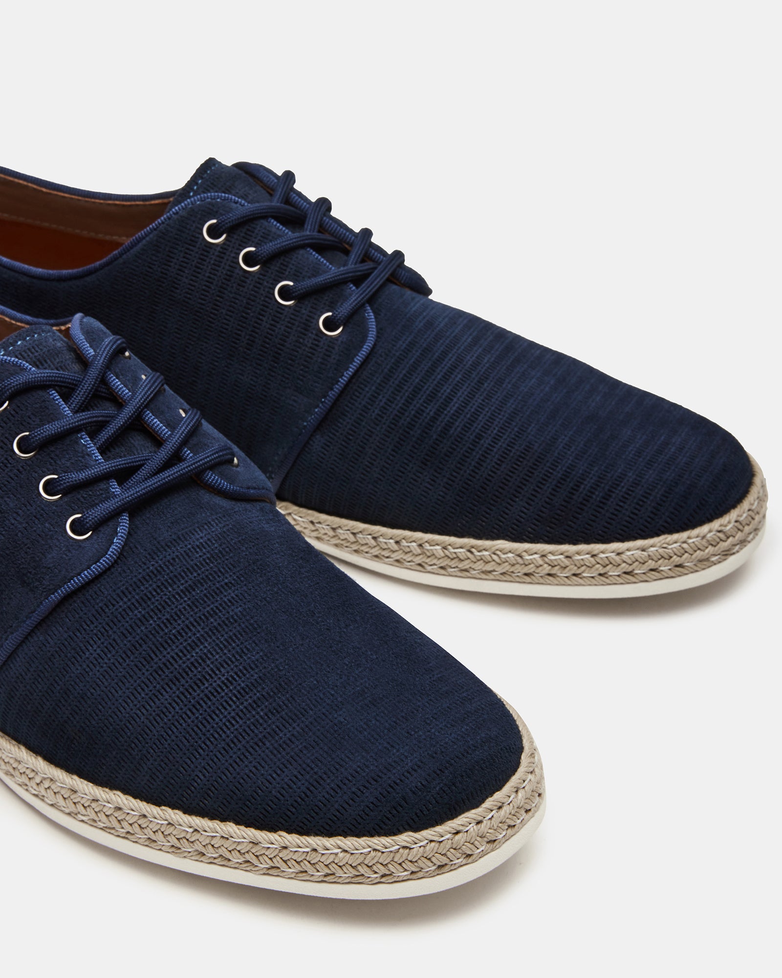 Bottom view of Menorca navy suede shoes highlighting the rubber sole and casual style