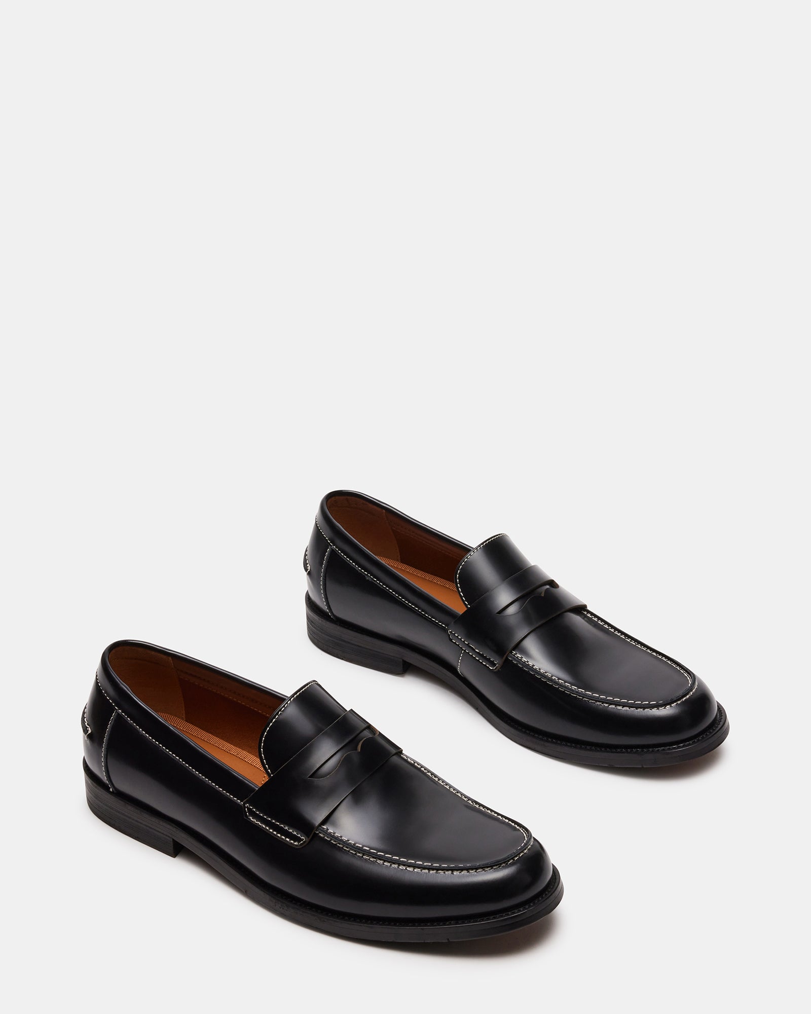 Close-up of Natan black leather loafers, emphasizing the craftsmanship.