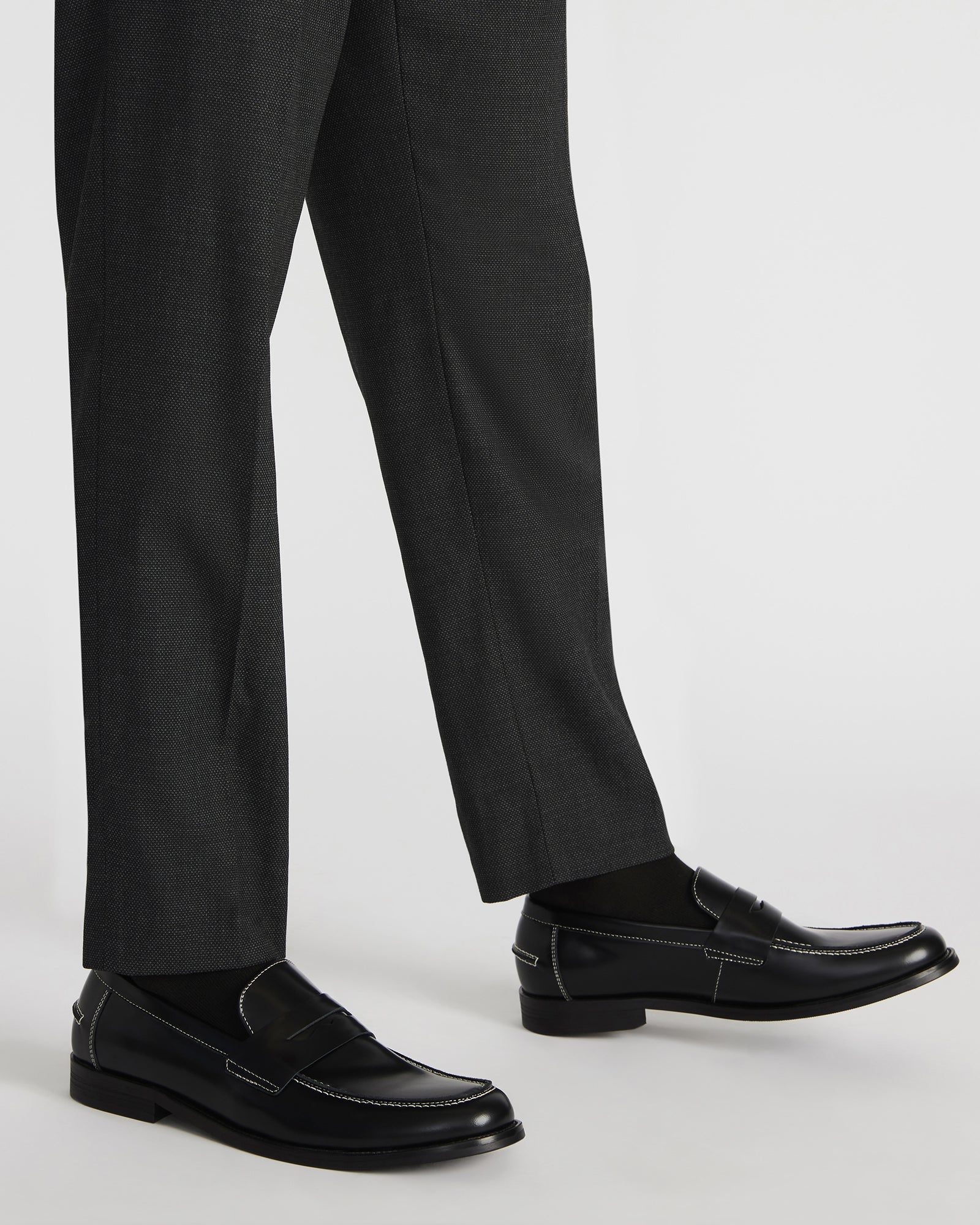 Overhead shot of penny loafers highlighting slip-on style and textile lining