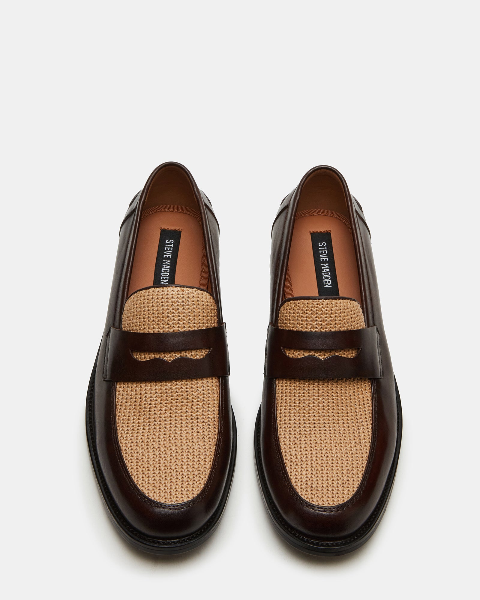 Overhead shot of penny loafers highlighting slip-on style and textile lining