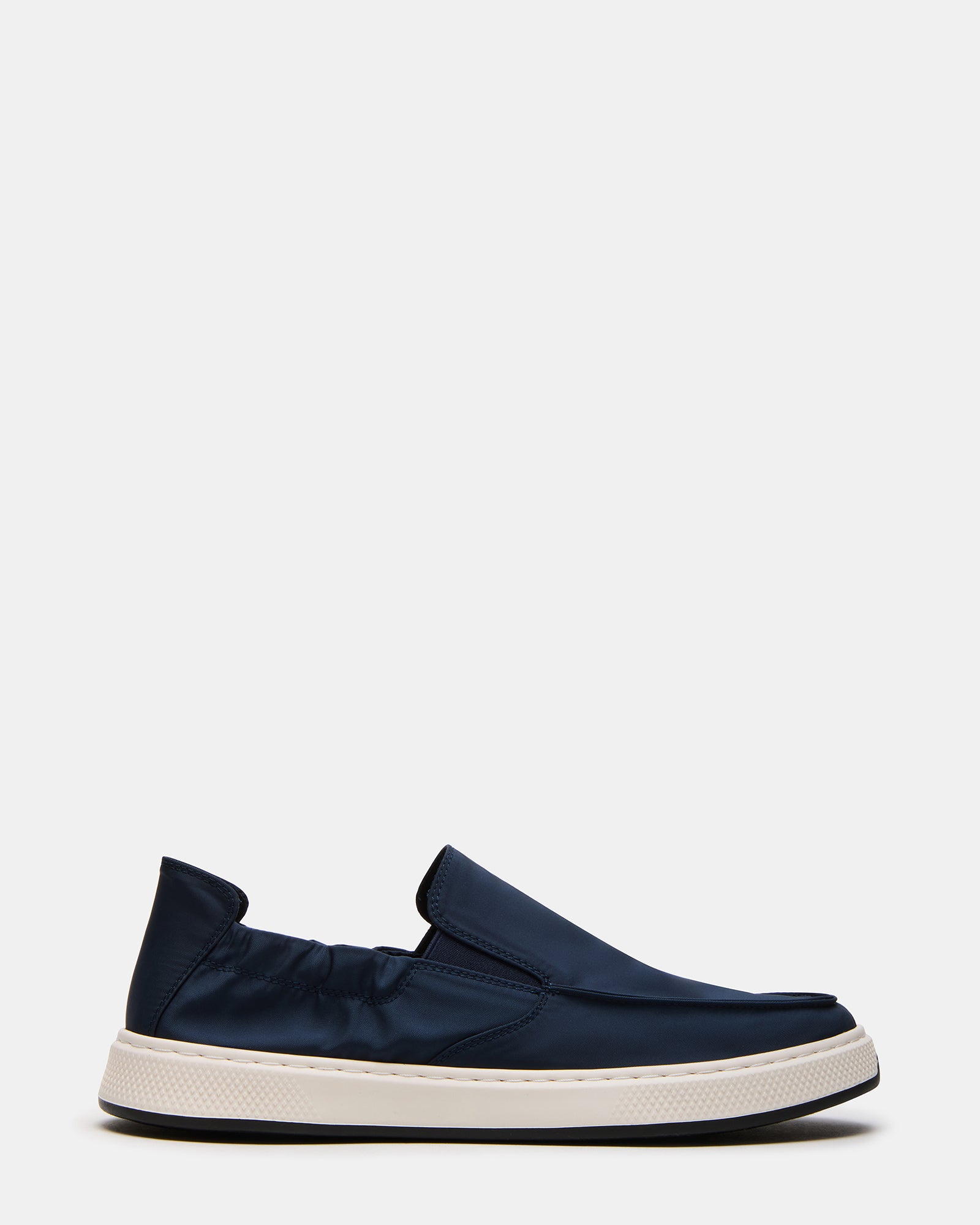 Nellis Navy slip-on loafers showcasing the sleek design and comfort.