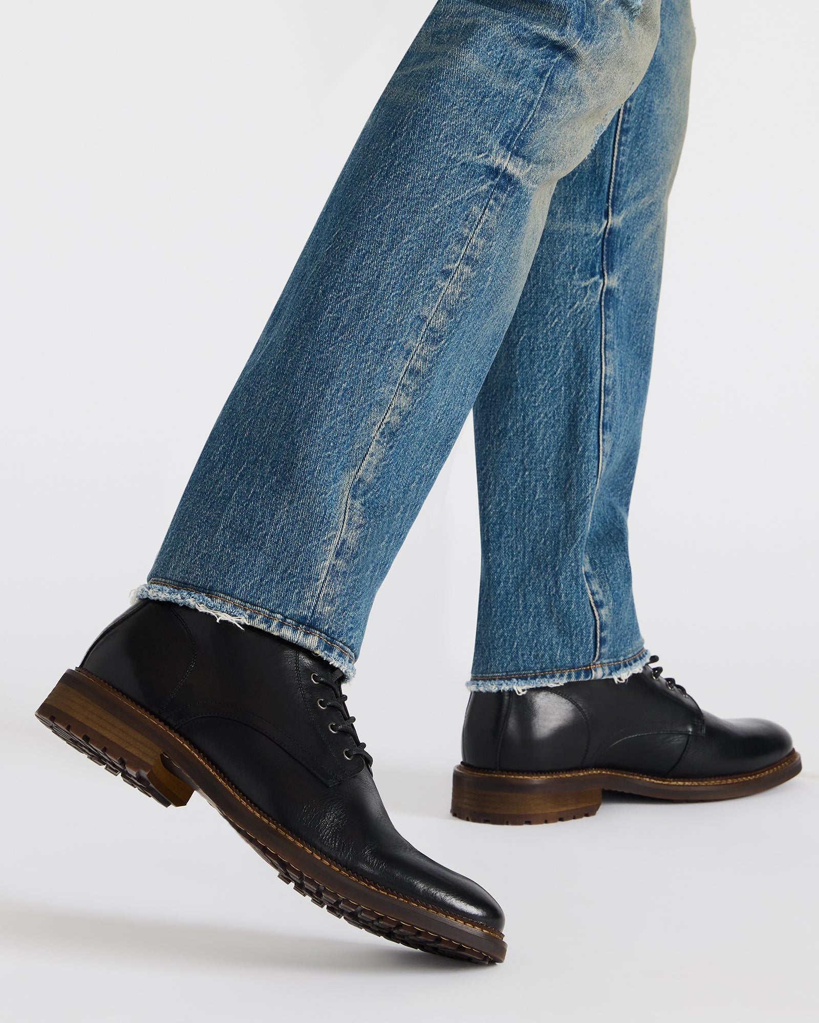 Close-up of Noby black ankle boots with lace-up detailing, ideal for stylish wear.