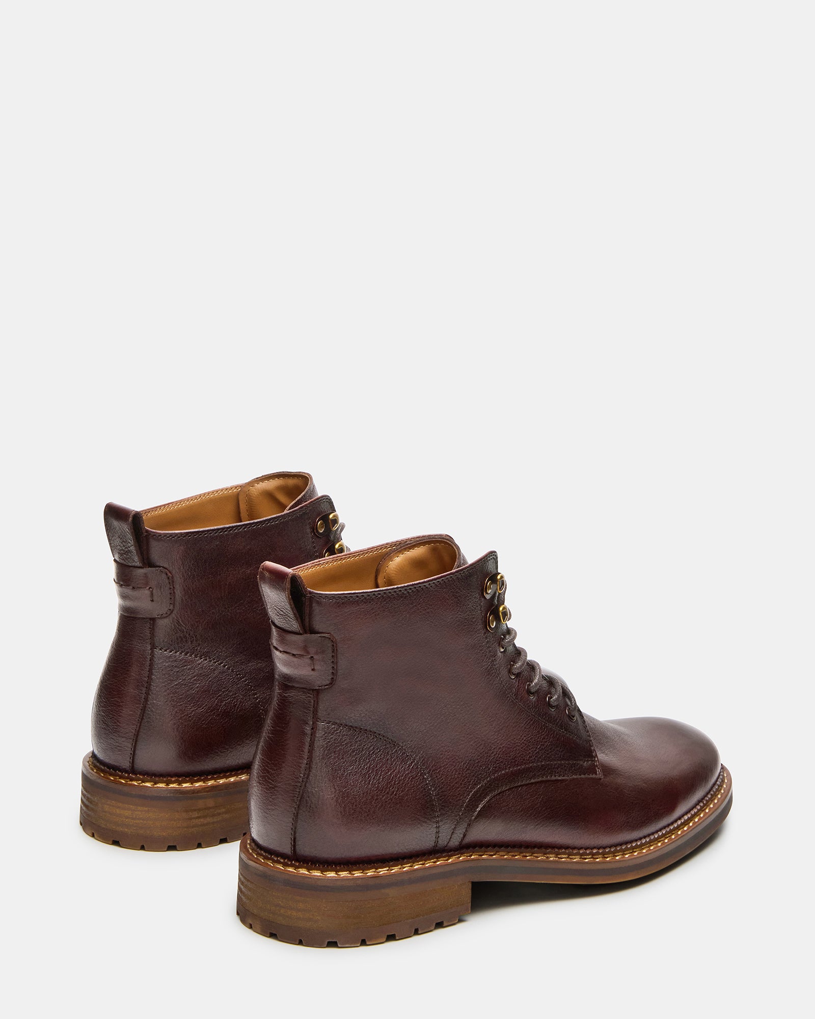 Rear view showing boot lace up boots heel height and sleek leather finish