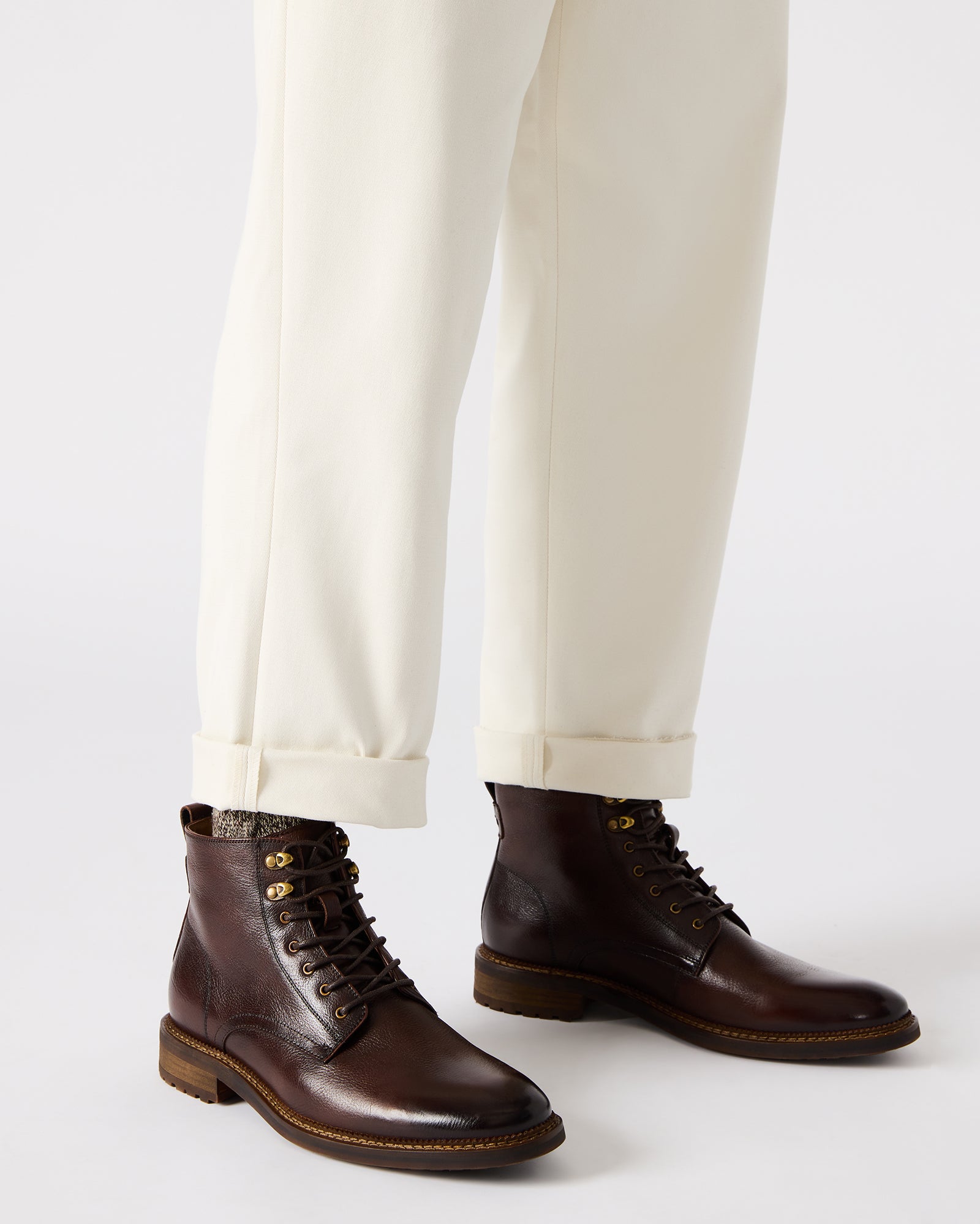 Closeup of the ankle boots for women showing the lace-up work boots stitching and sole grip