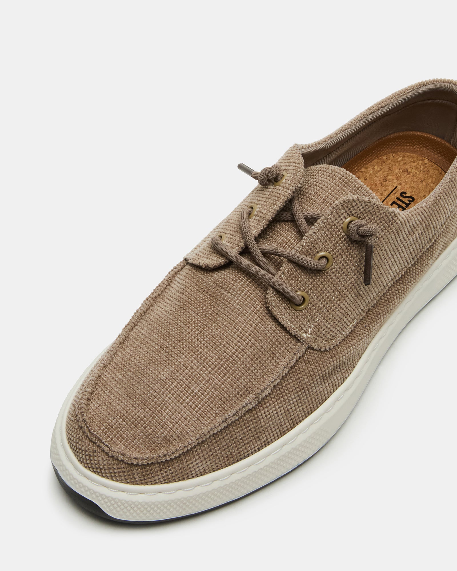 Side view of NUSCHI taupe slip-on shoes showcasing the low heel and rubber sole