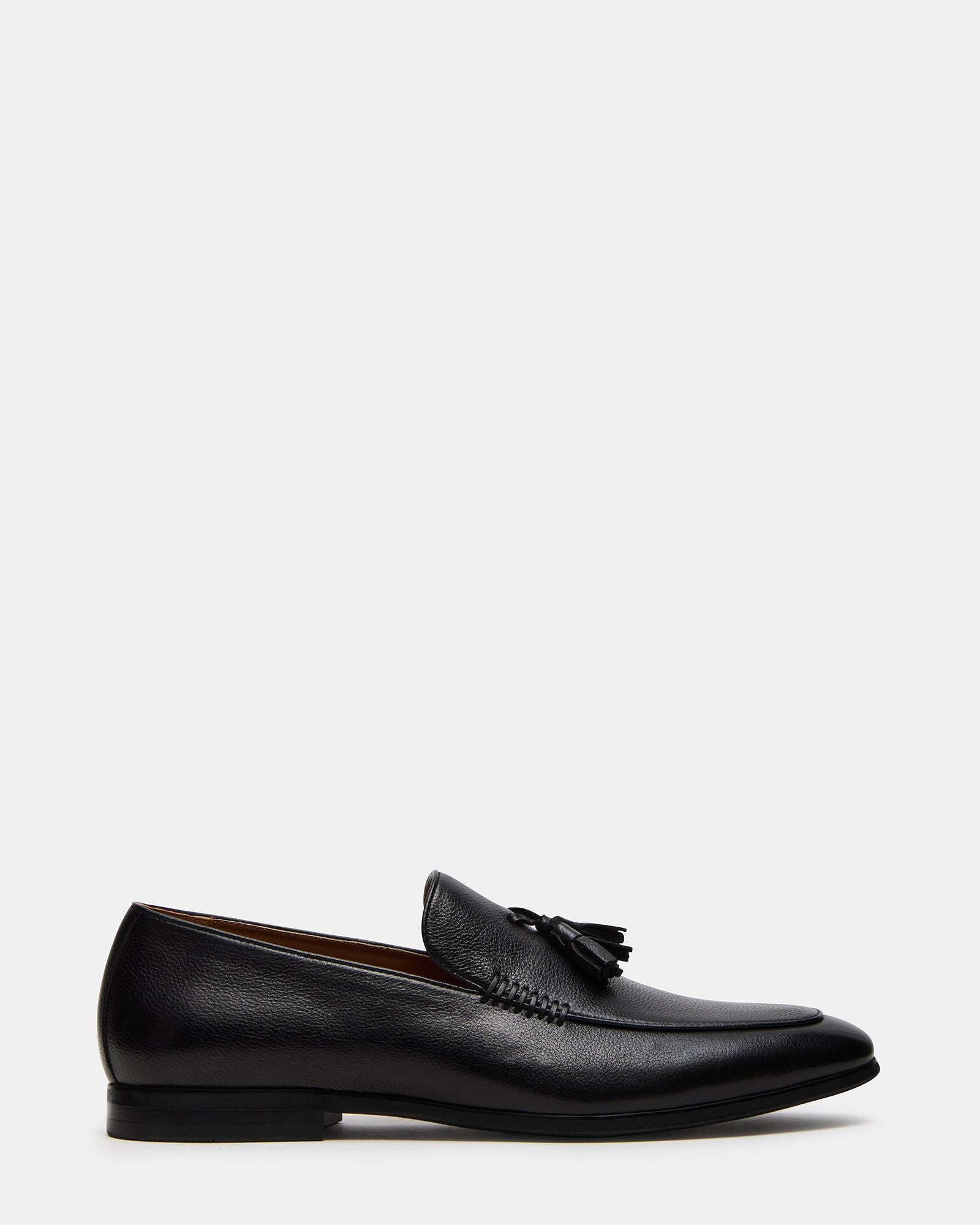 Close-up of ONDRE black leather loafers showcasing tassel detail.