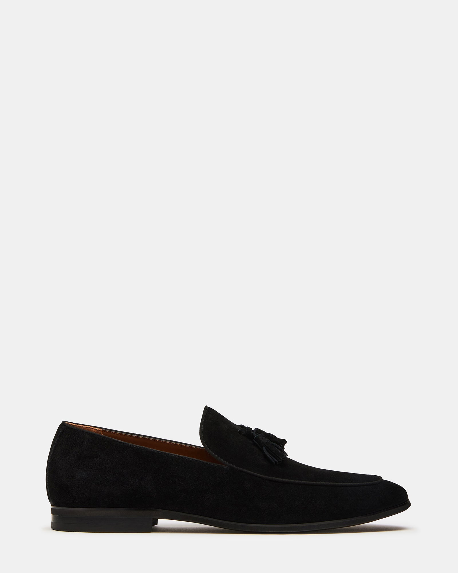 Side view of ONDRE black suede tassel loafers showcasing the almond toe and tassel detail
