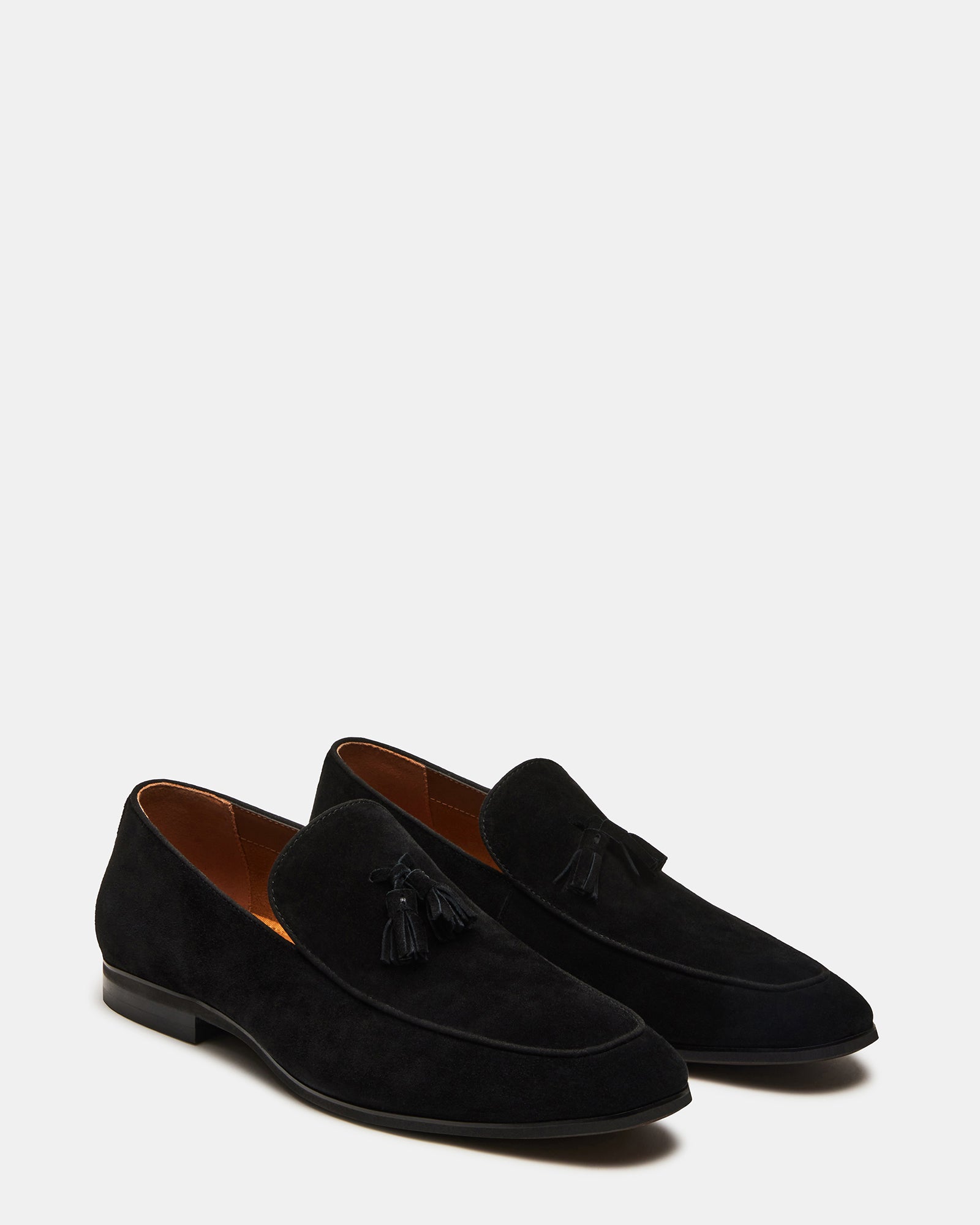 Top-down shot of mens black suede loafers highlighting slip-on style and elegant design
