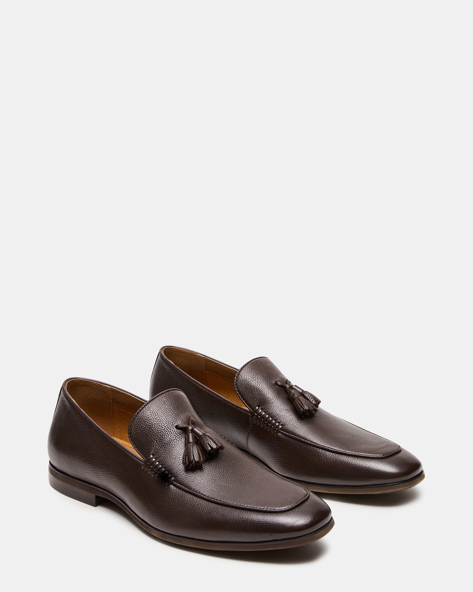 Side view of ONDRE mens tassel loafers highlighting the almond toe design.