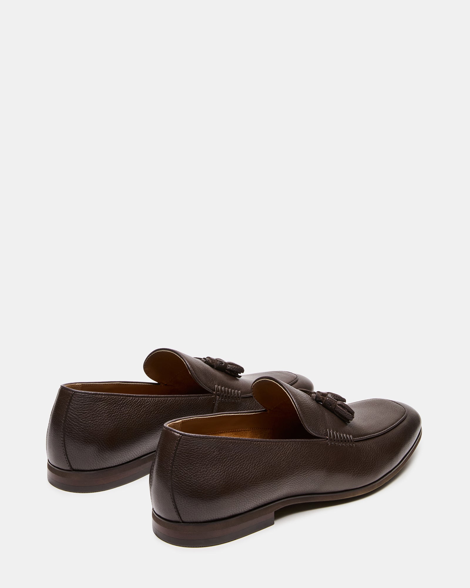 Side view of ONDRE mens tassel loafers highlighting the almond toe design.