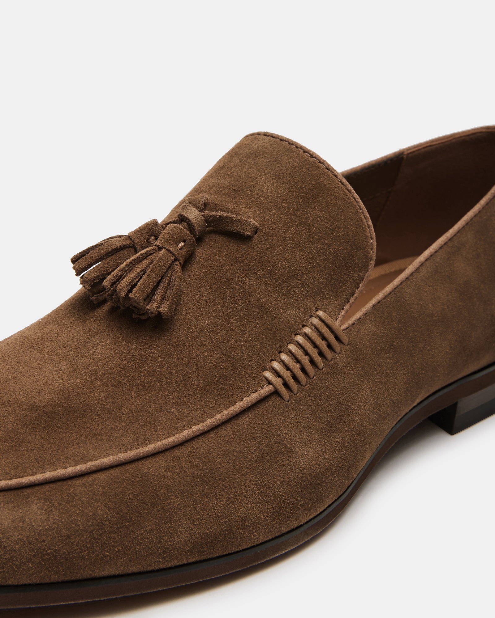 Mens suede loafers in tan, showcasing almond toe and tassel accent
