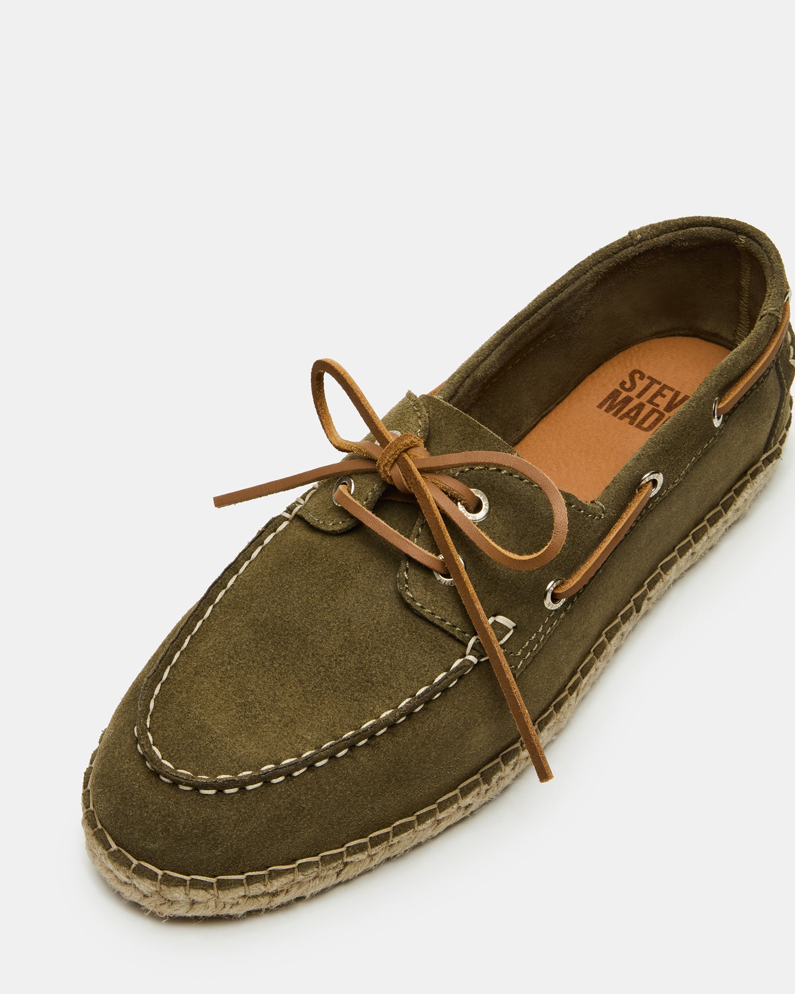 Pancho Olive Suede Slip-Ons worn casually on a sunny day.