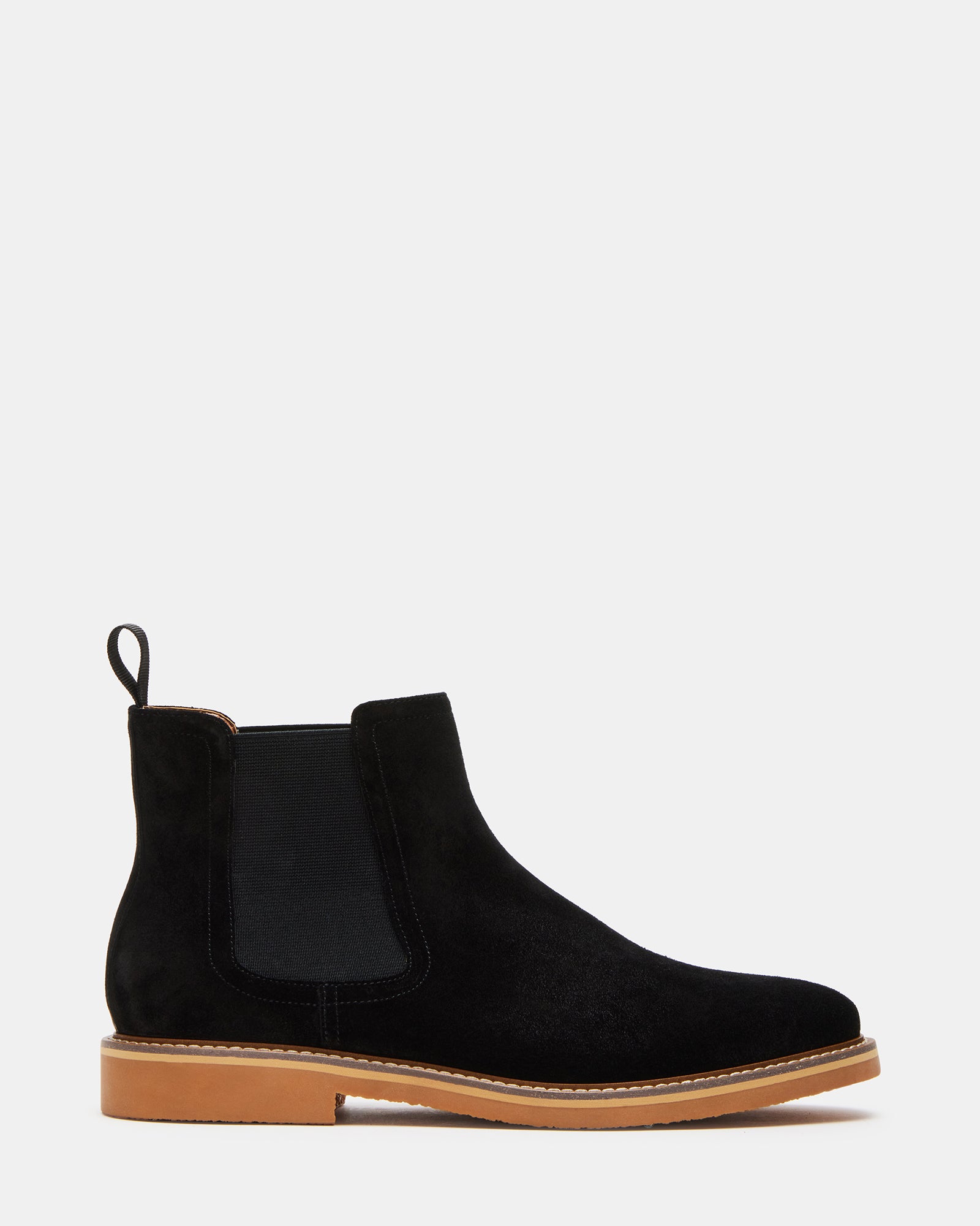 Side view of black chelsea boots with textured suede finish and low heel