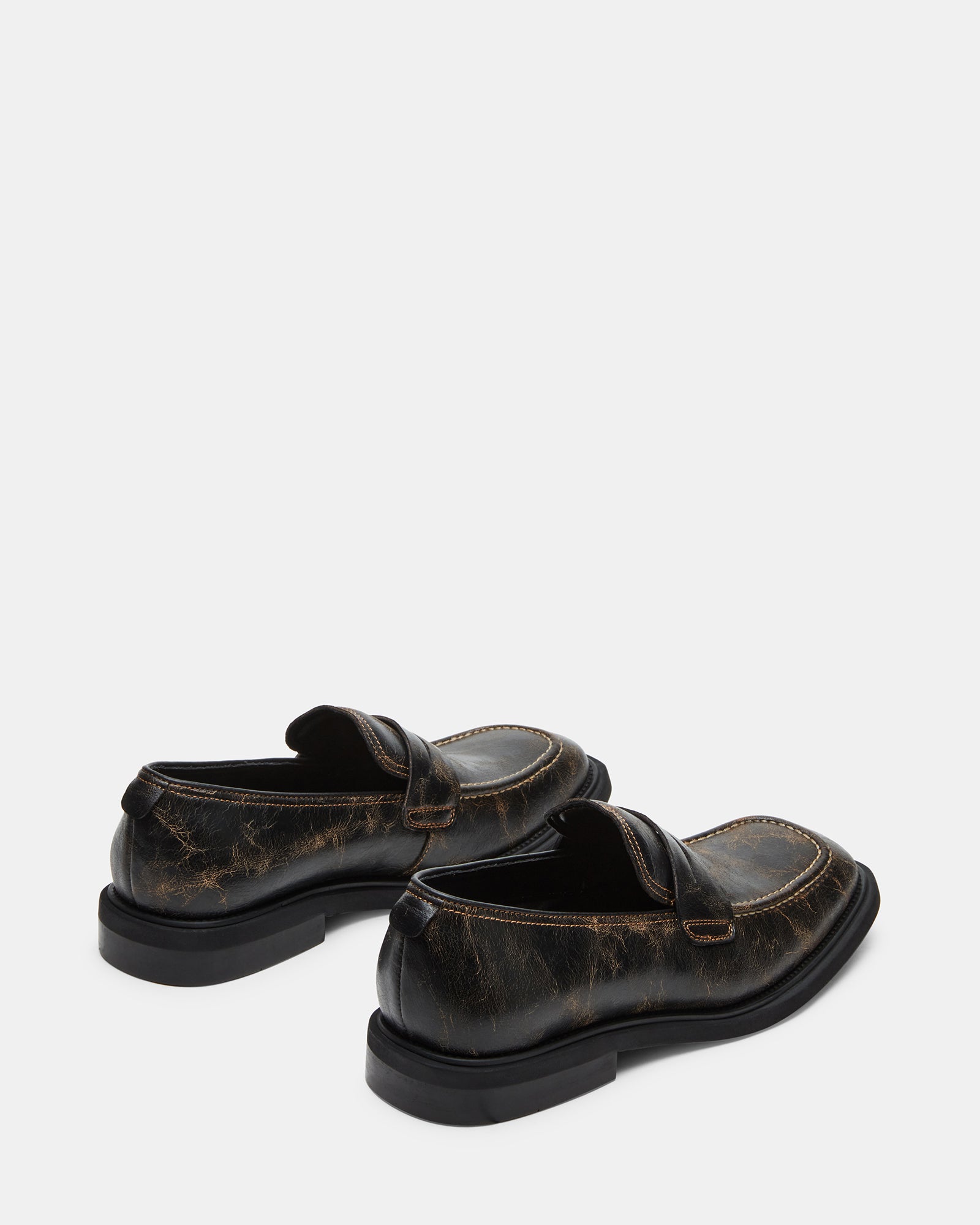 Close-up of Pericon distressed loafers, highlighting the luxurious leather material.