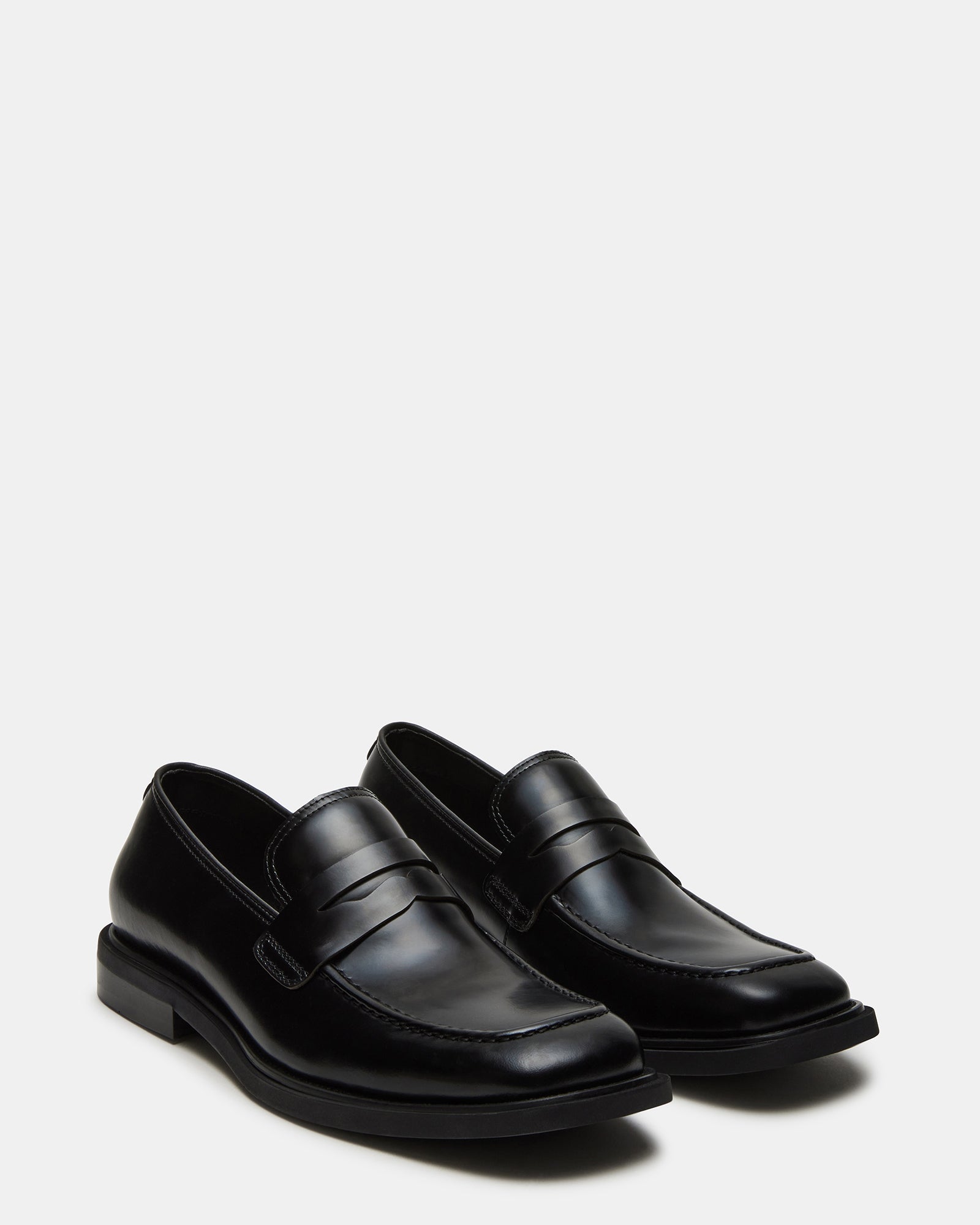 Close-up of mens dress loafers showing square toe and leather texture