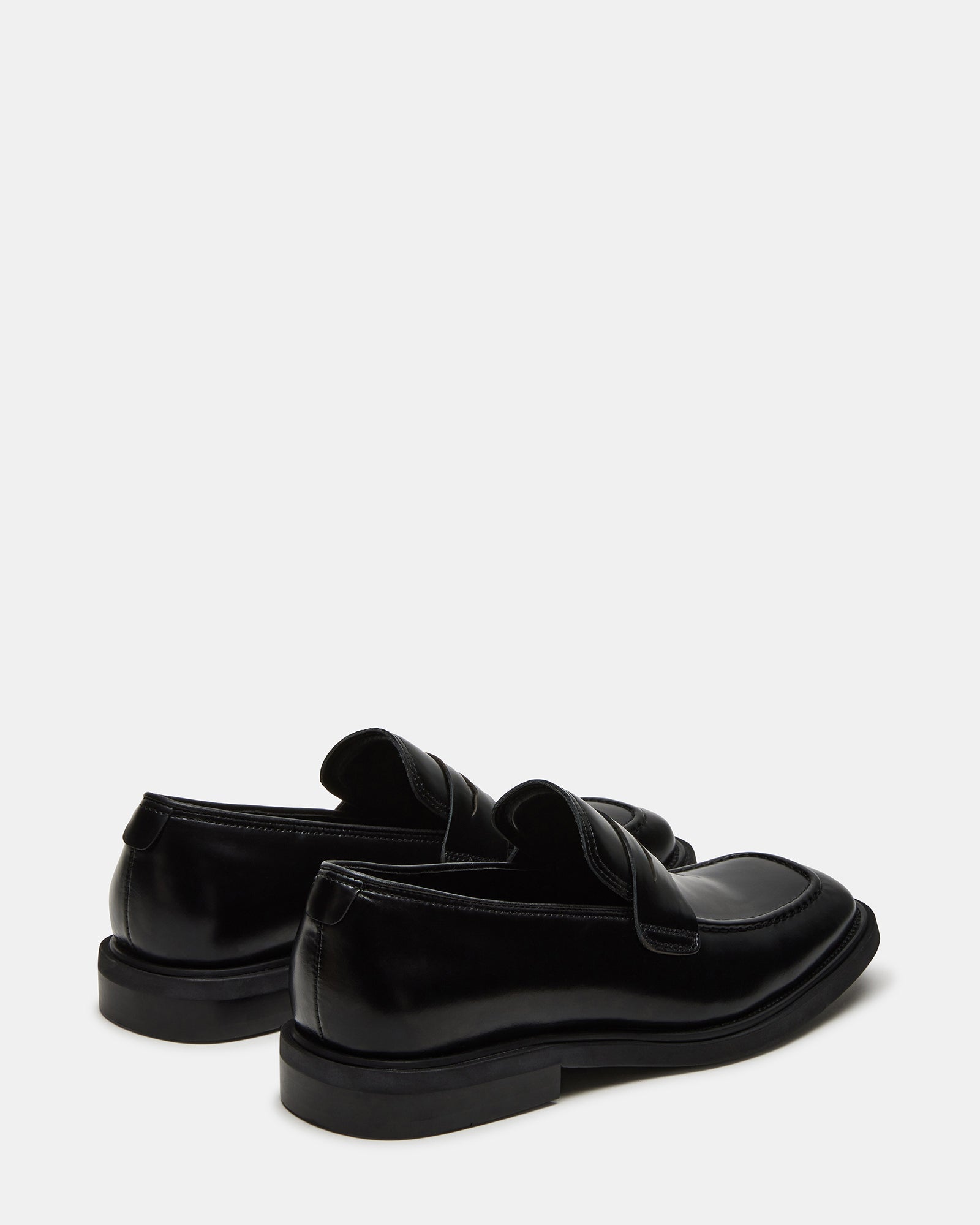 Close-up of mens dress loafers showing square toe and leather texture