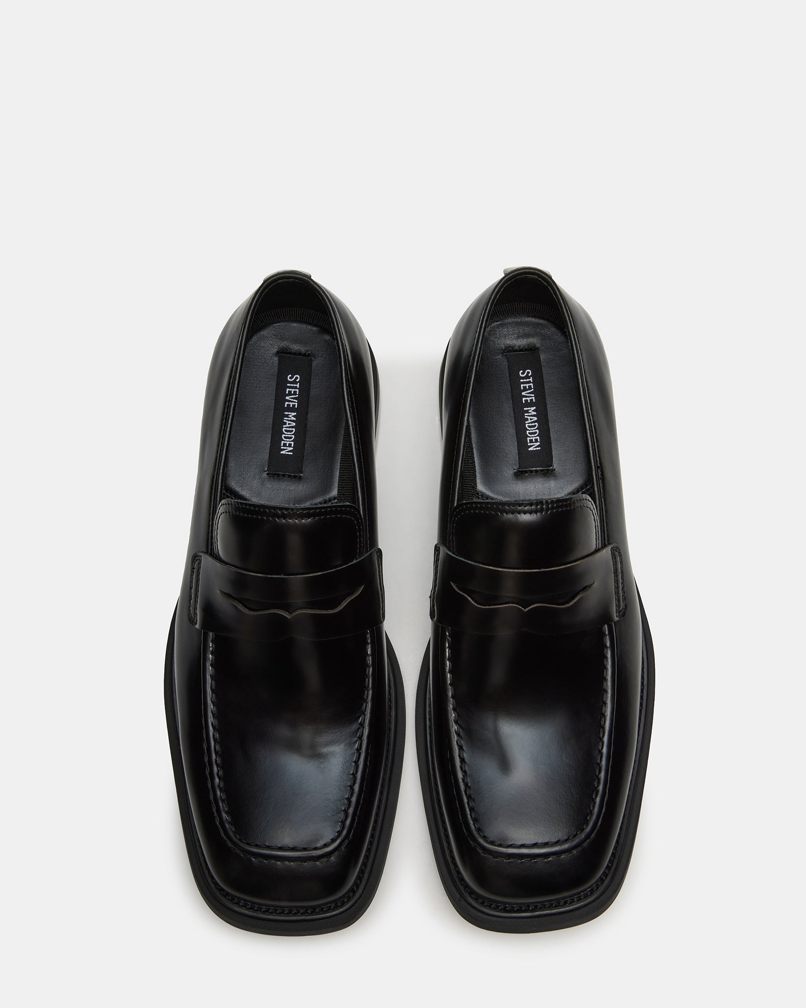 Pericon black leather penny loafers side view on hardwood floor