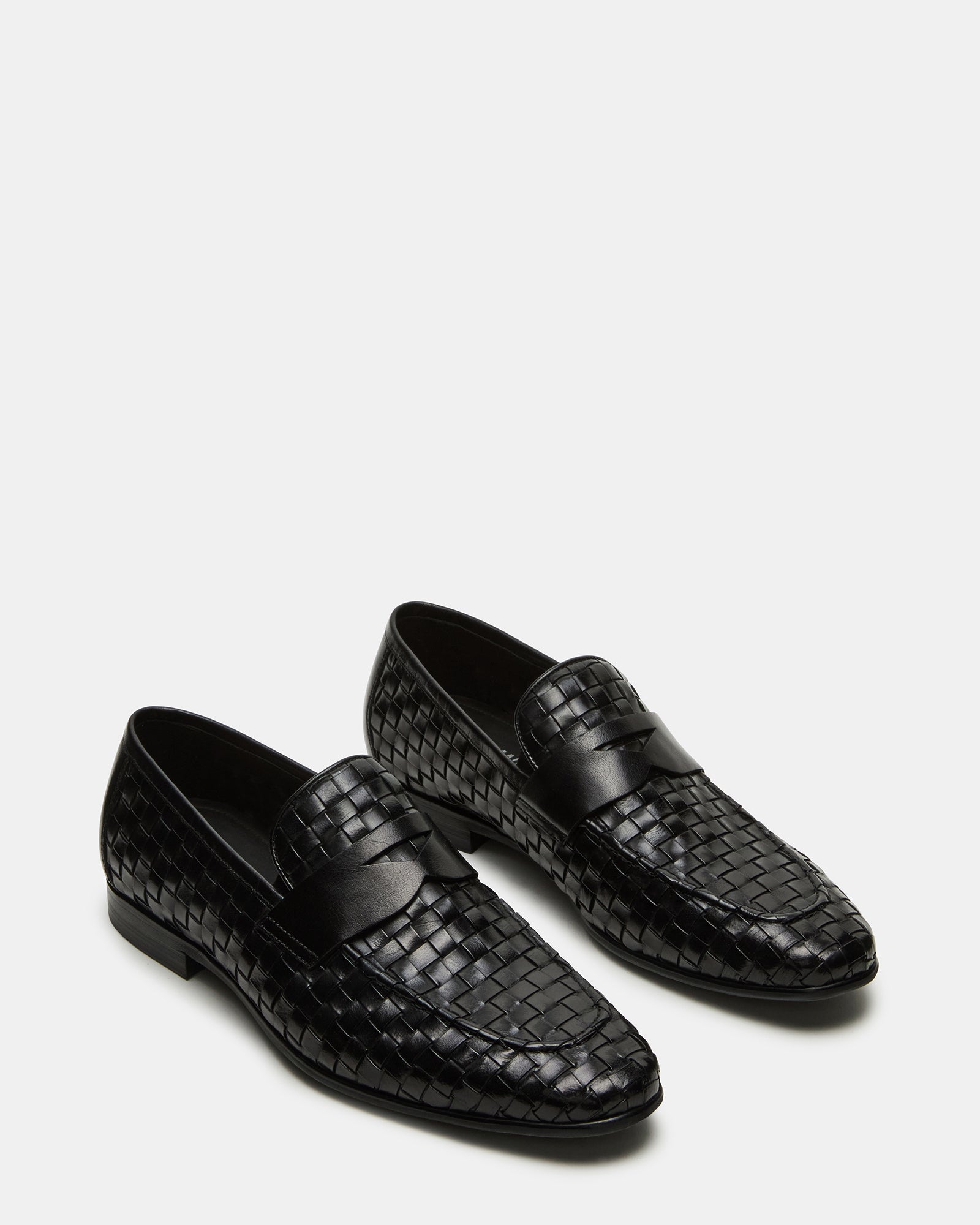 Poco leather loafers worn with formal attire, highlighting their elegant look.