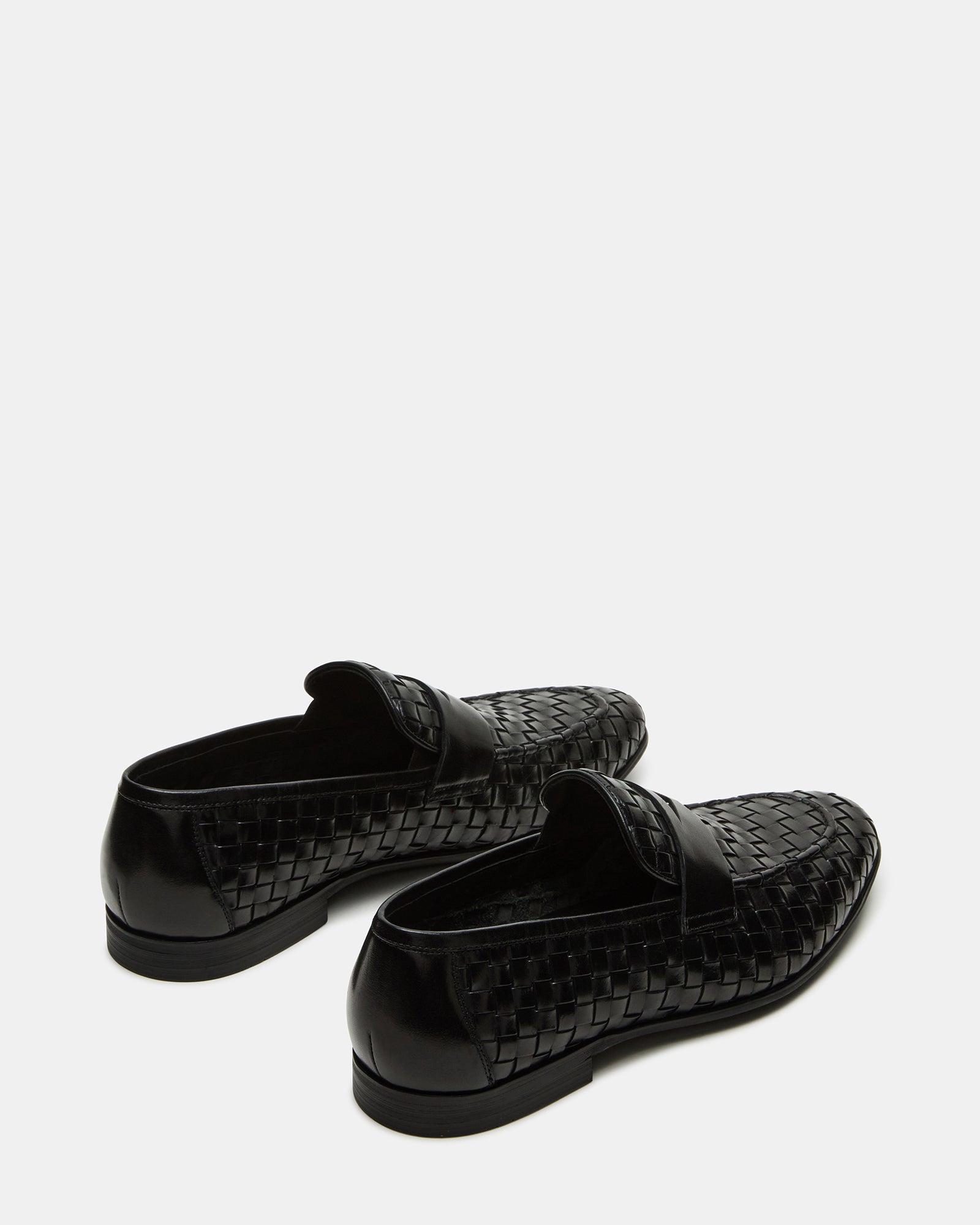 Poco leather loafers worn with formal attire, highlighting their elegant look.