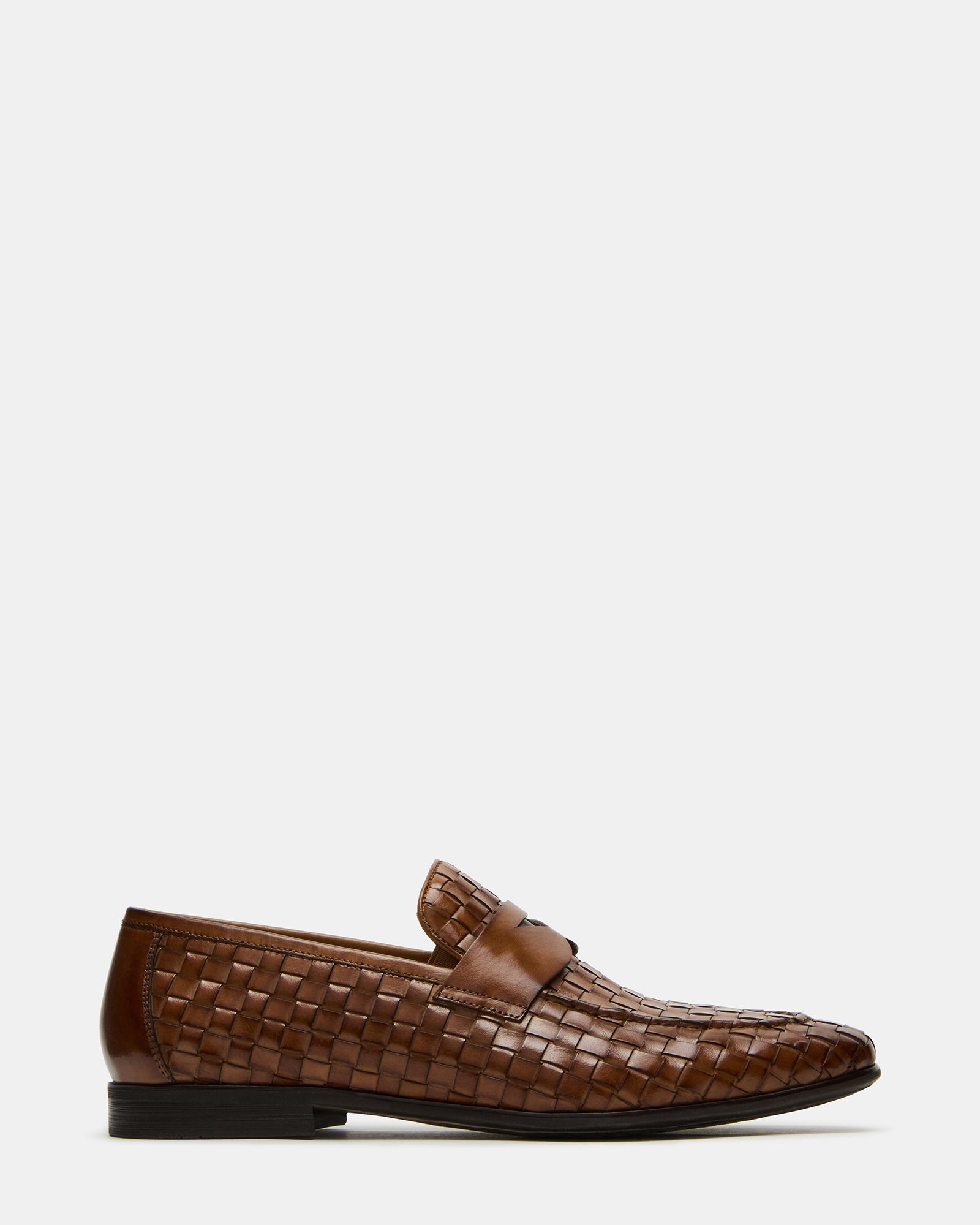 Side view of tan woven mens loafers showing slip-on design and heel height