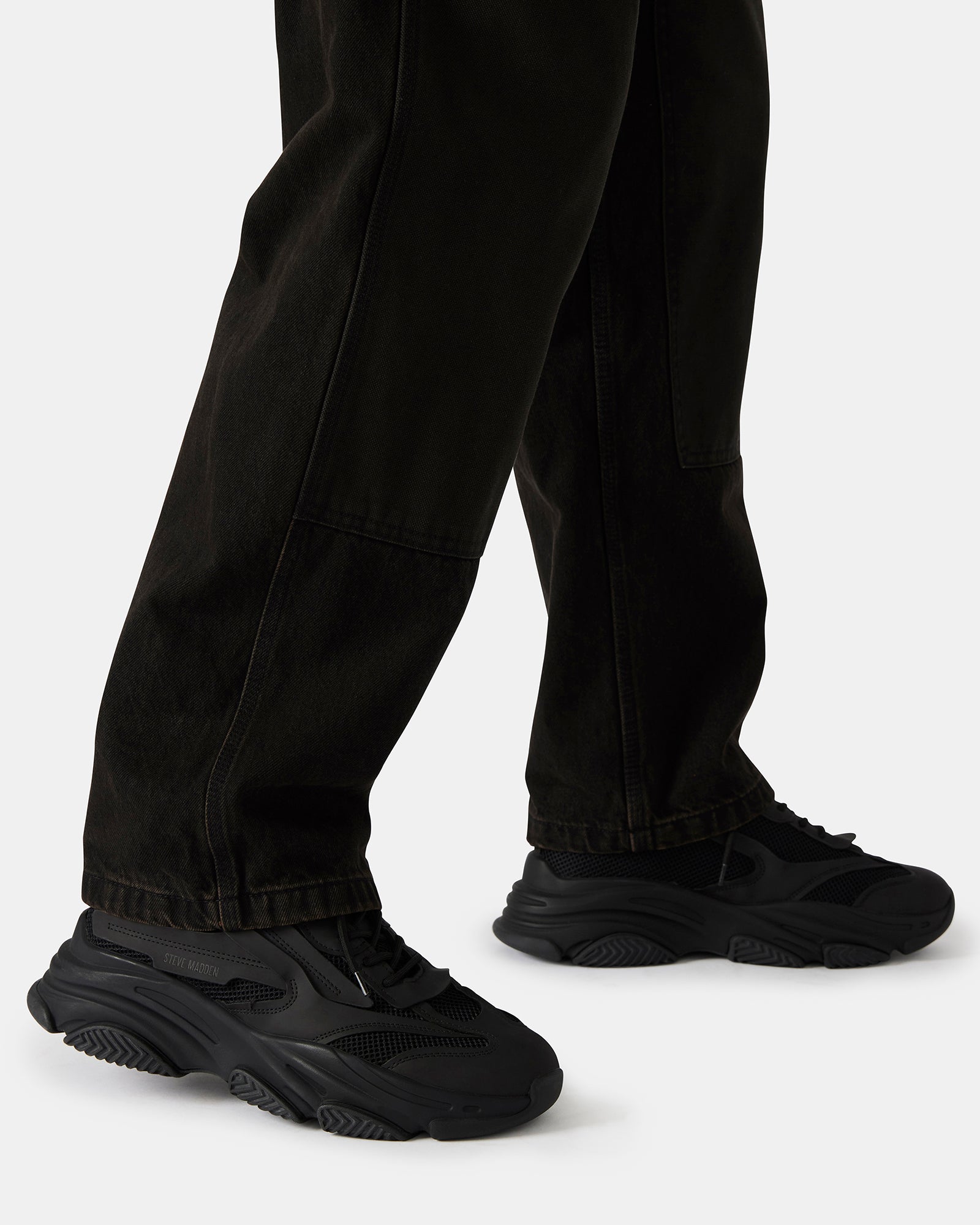 Close-up of the laced closure on the chunky platform sneakers.