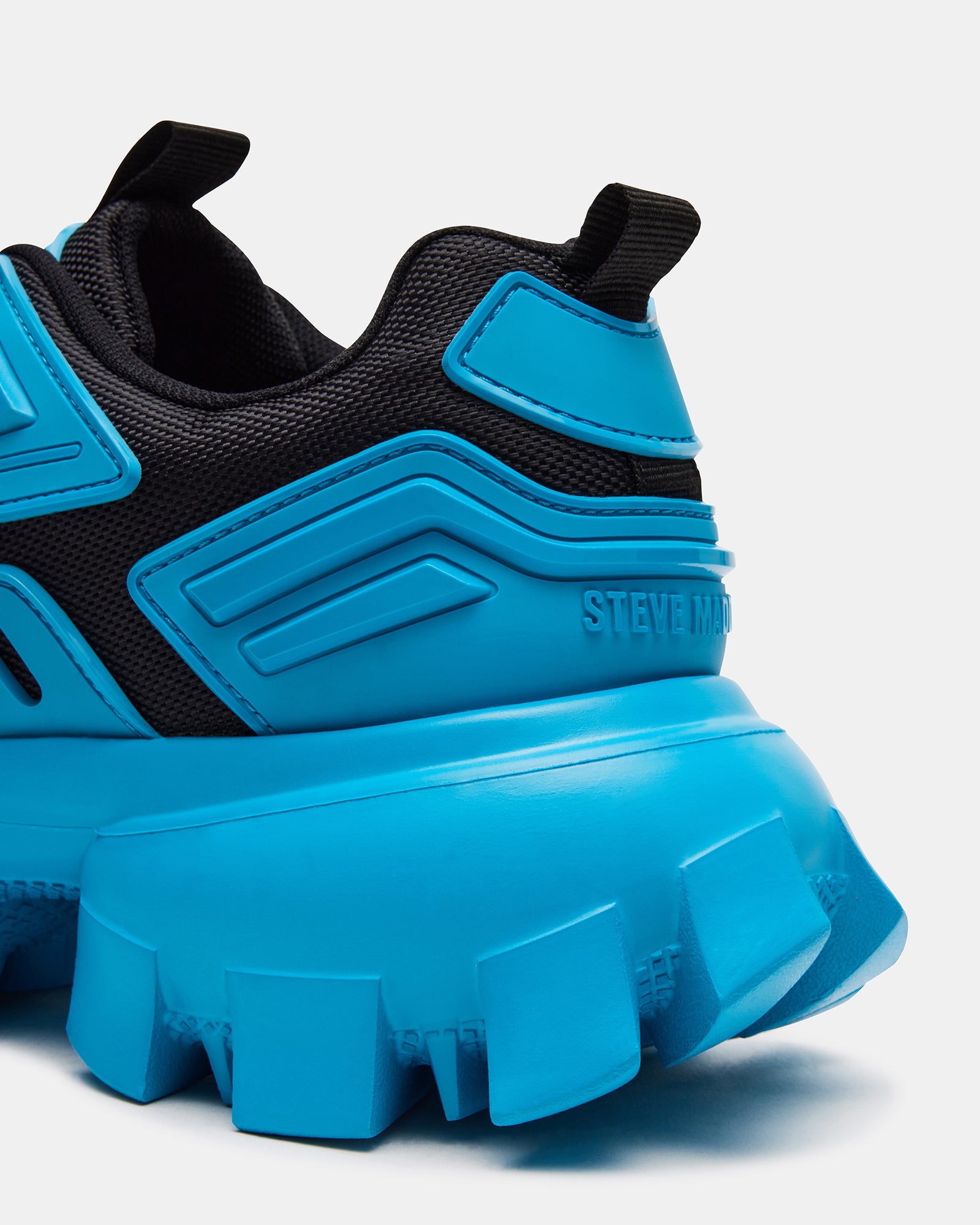 Ponce Blue Multi chunky sneakers worn casually in a city setting.