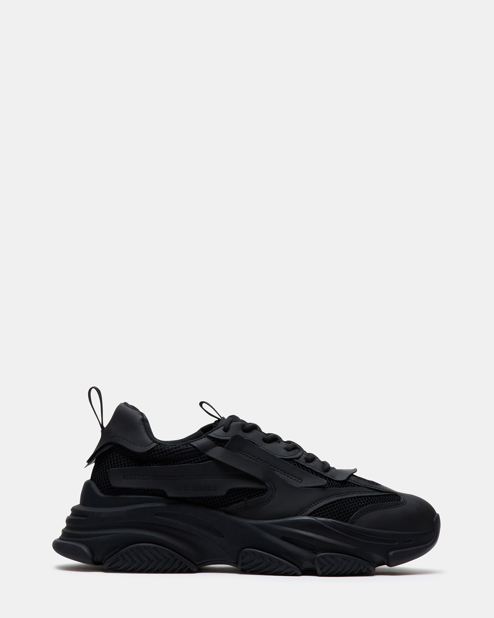 Side view of Possess chunky platform sneakers in black.
