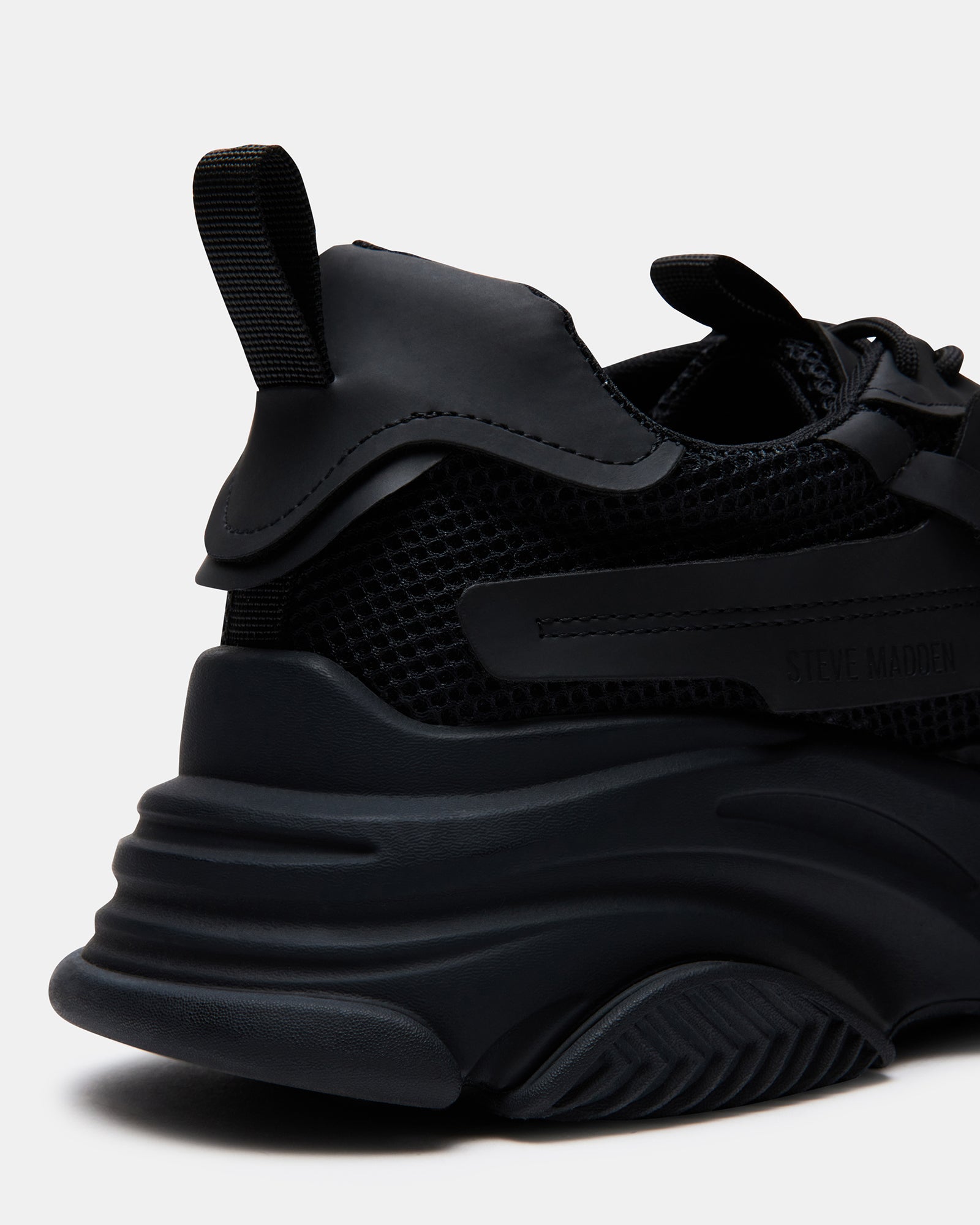Close-up of the laced closure on the chunky platform sneakers.