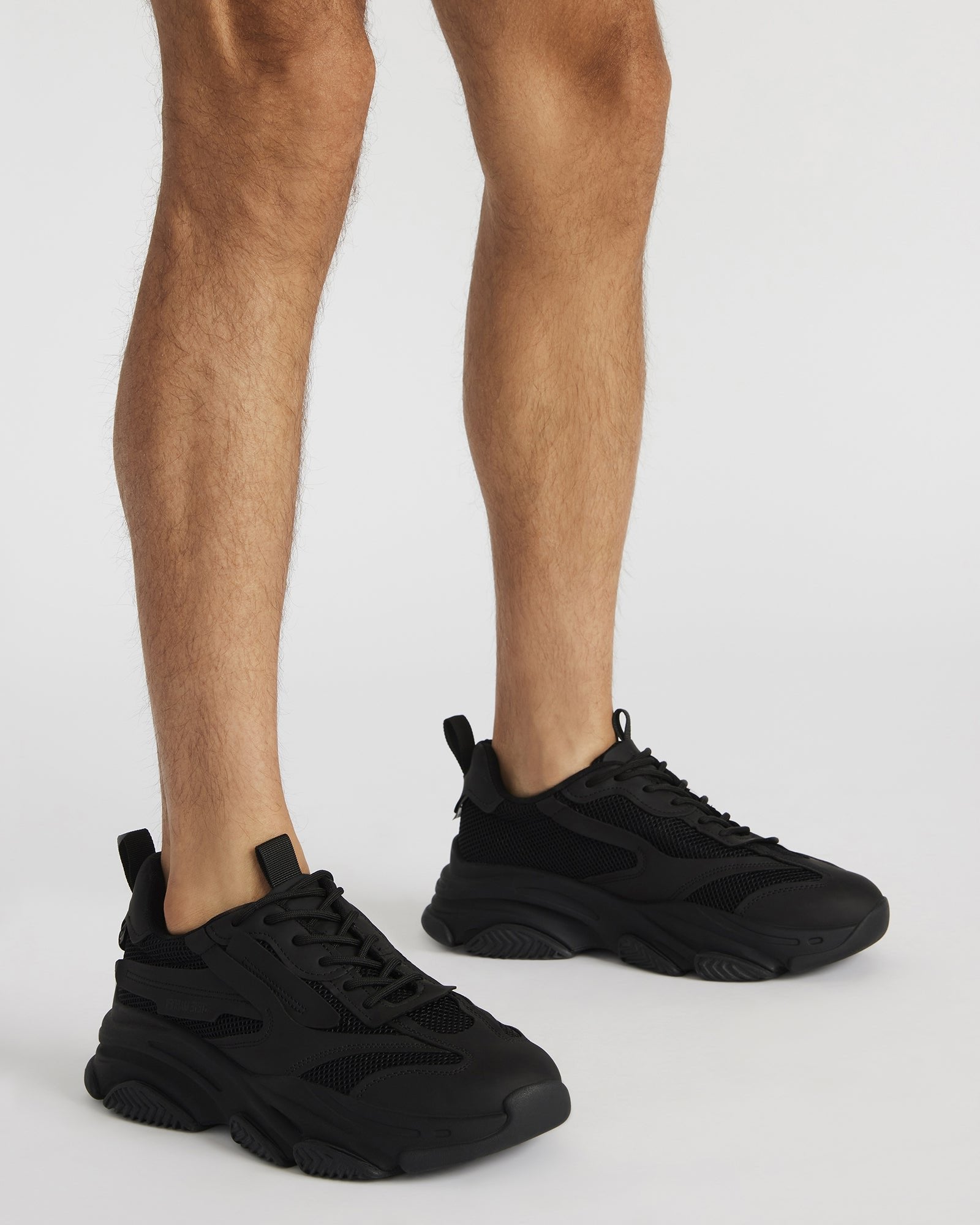 Possess Navy chunky platform sneakers worn during a casual outing.