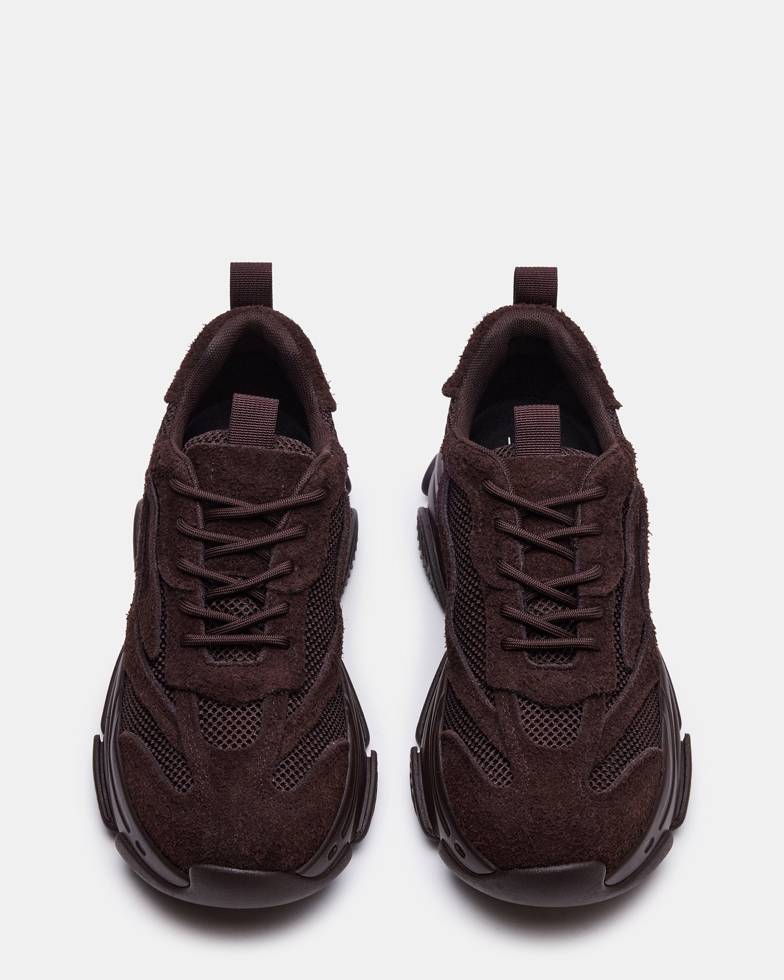 Close-up of the chunky platform and laced closure of the sneakers.
