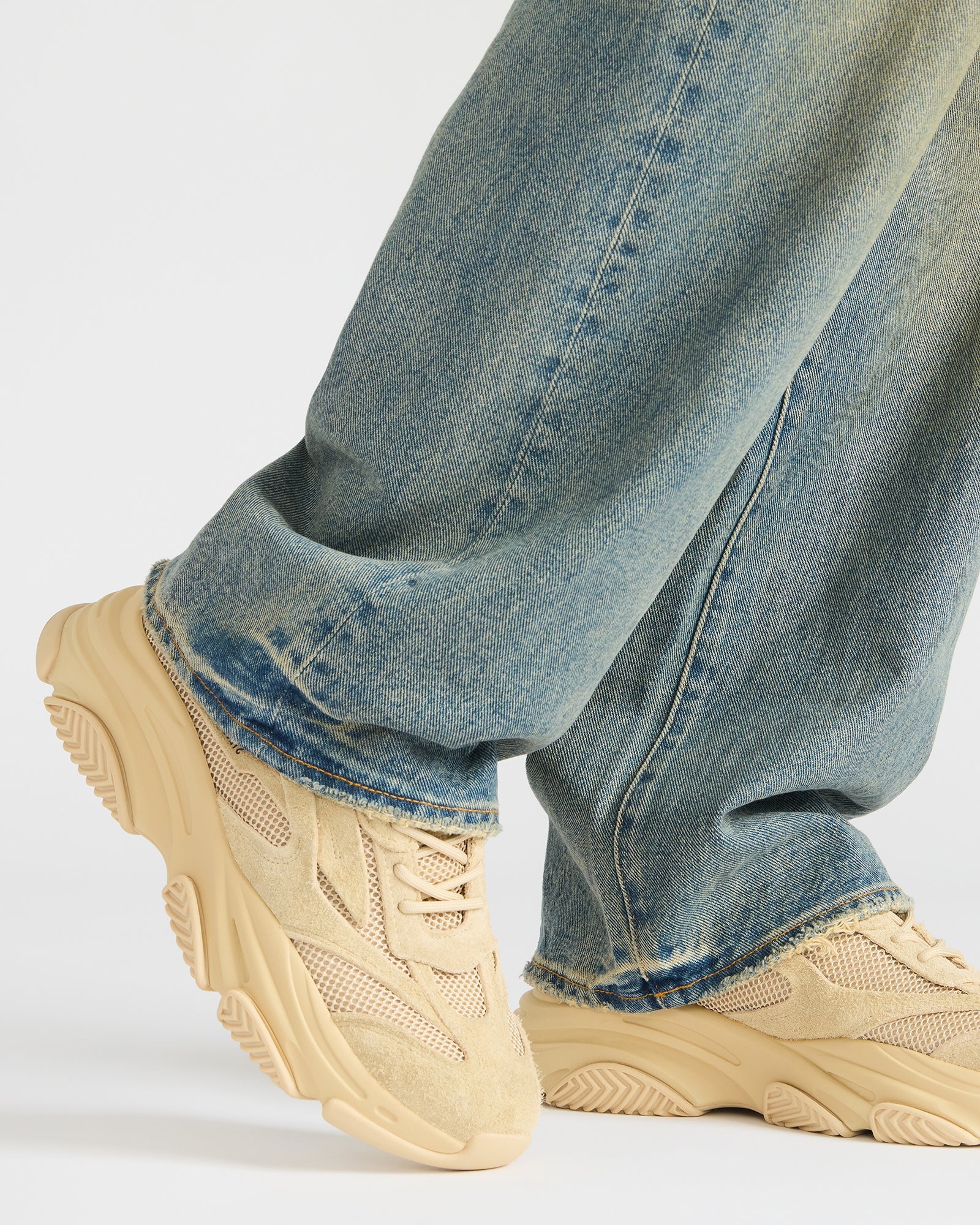 Close-up of the mesh and suede upper of the platform sneakers, highlighting texture.