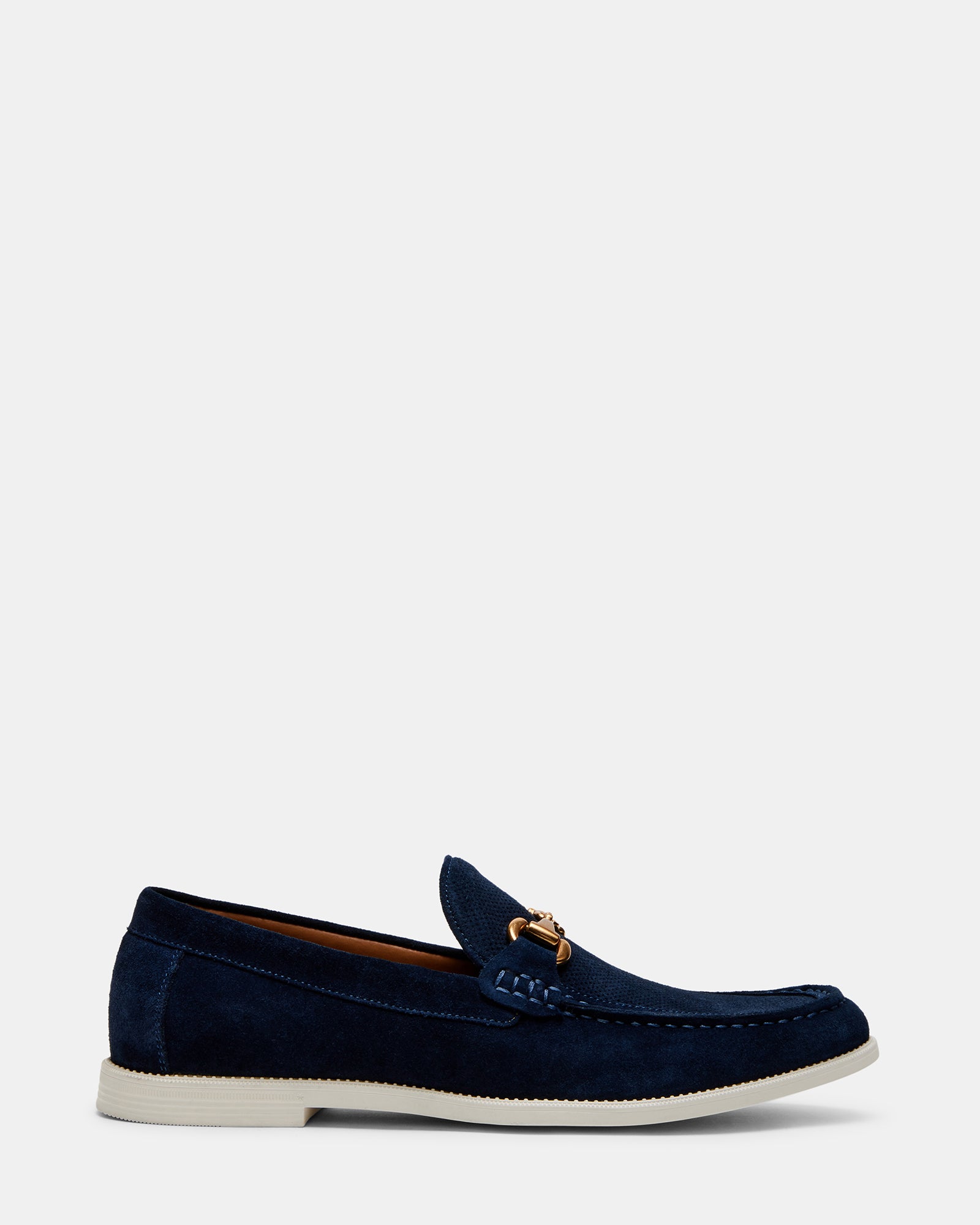 Side view of navy suede penny loafers showing moc toe and textured rubber sole