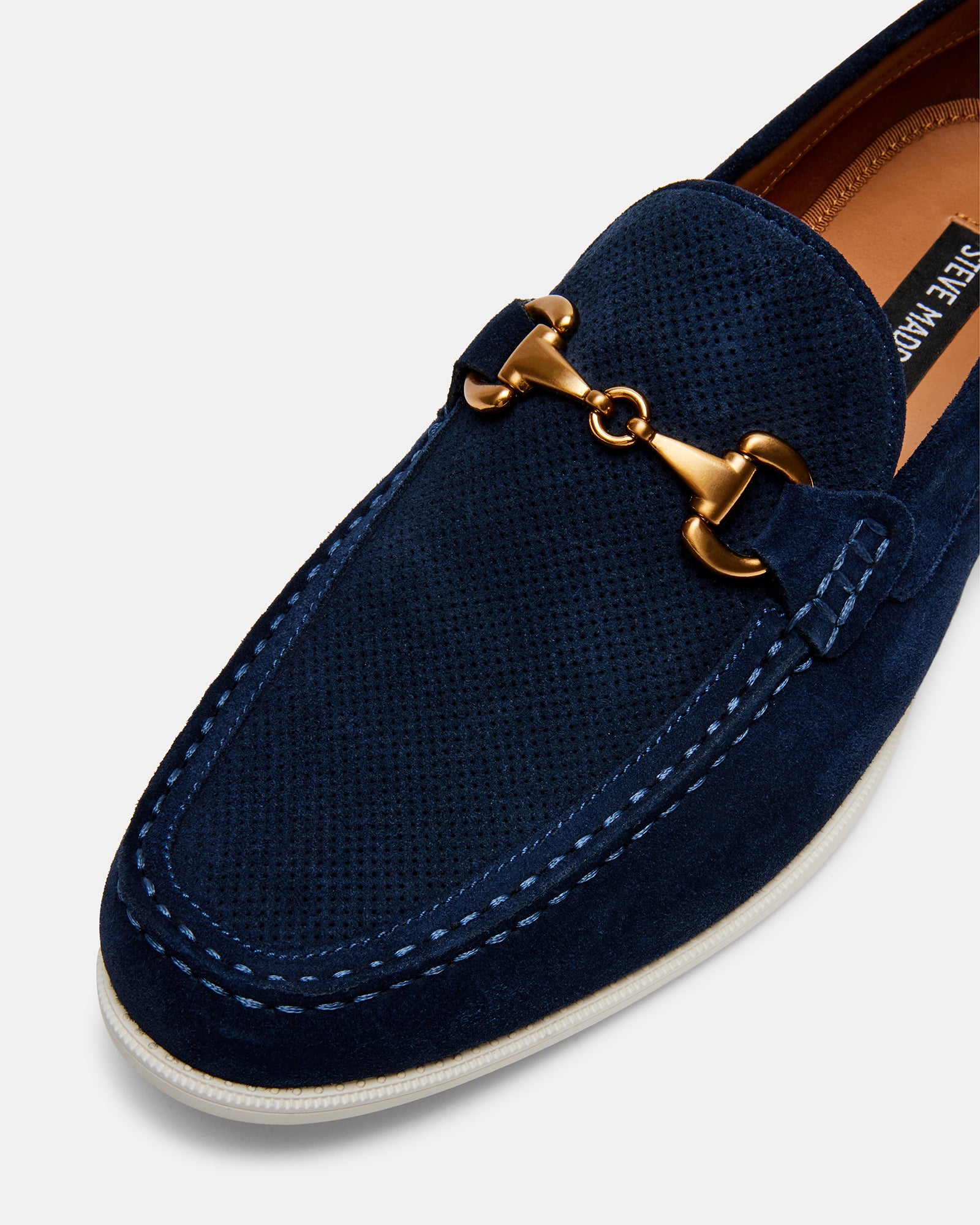Mens loafers styled with denim—casual footwear choice for a weekend look
