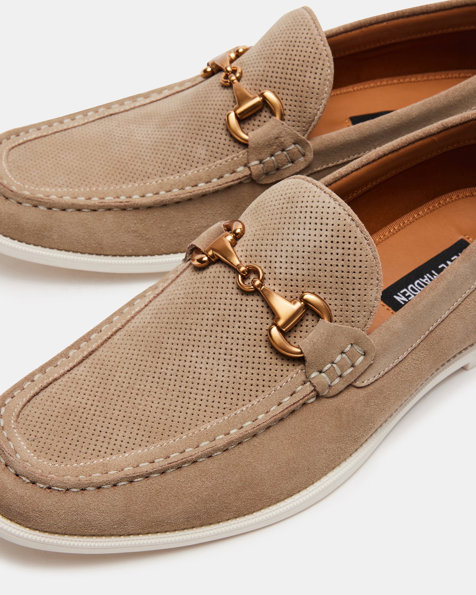 Stylish loafers paired with casual trousers, showcasing their versatility