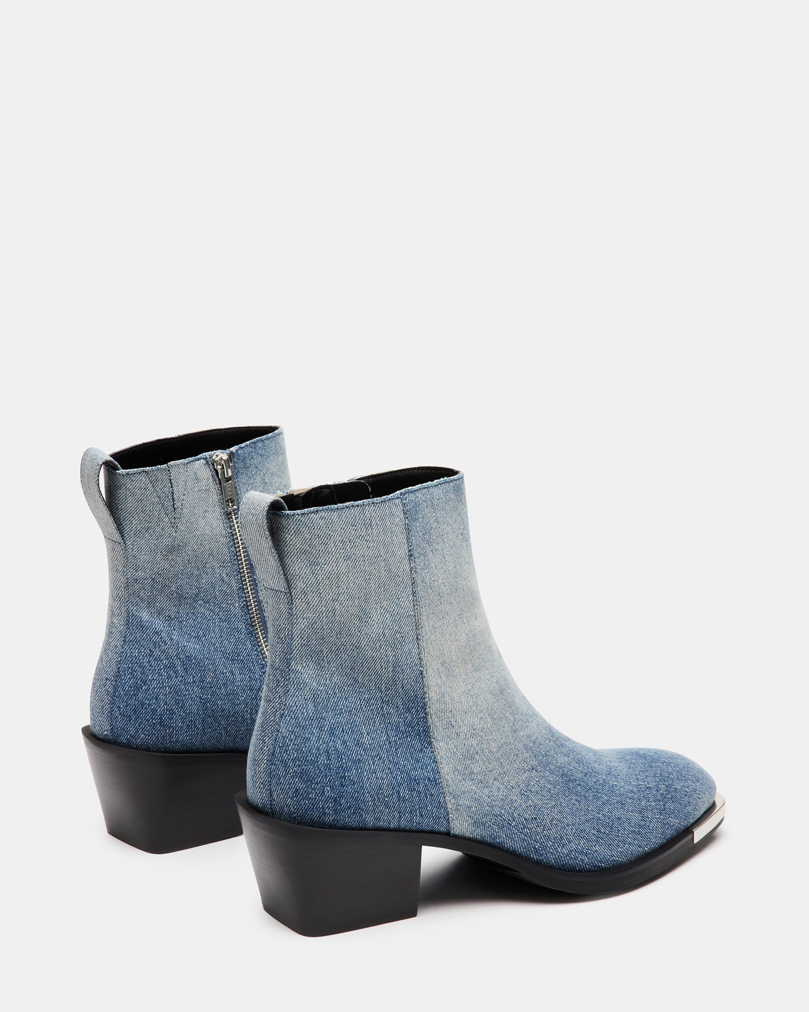 Close-up of the block heel and western stitching details