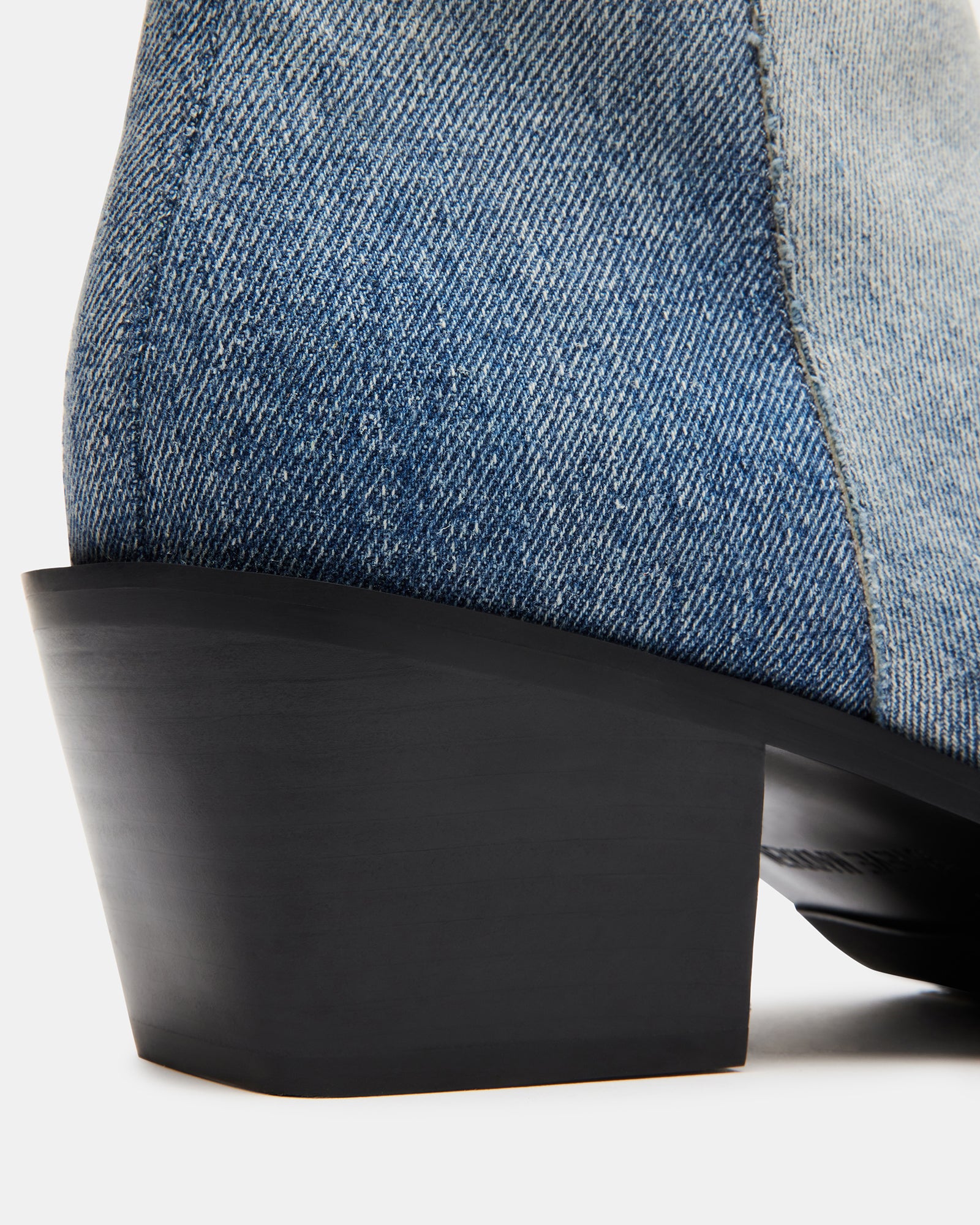 Side view showcasing the zipper closure and tapered toe