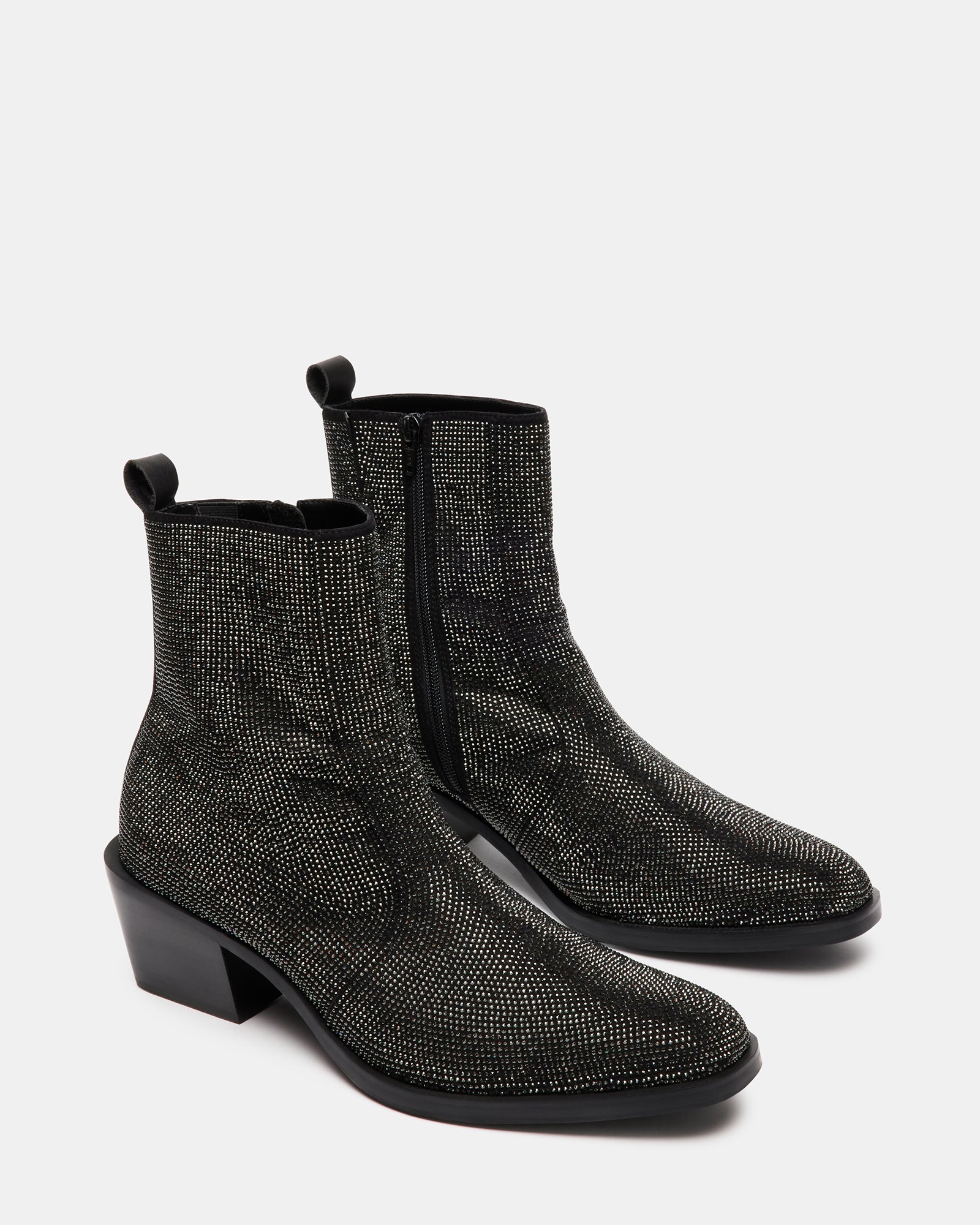 Close-up of kitten heel and rhinestone detailing on ankle boots