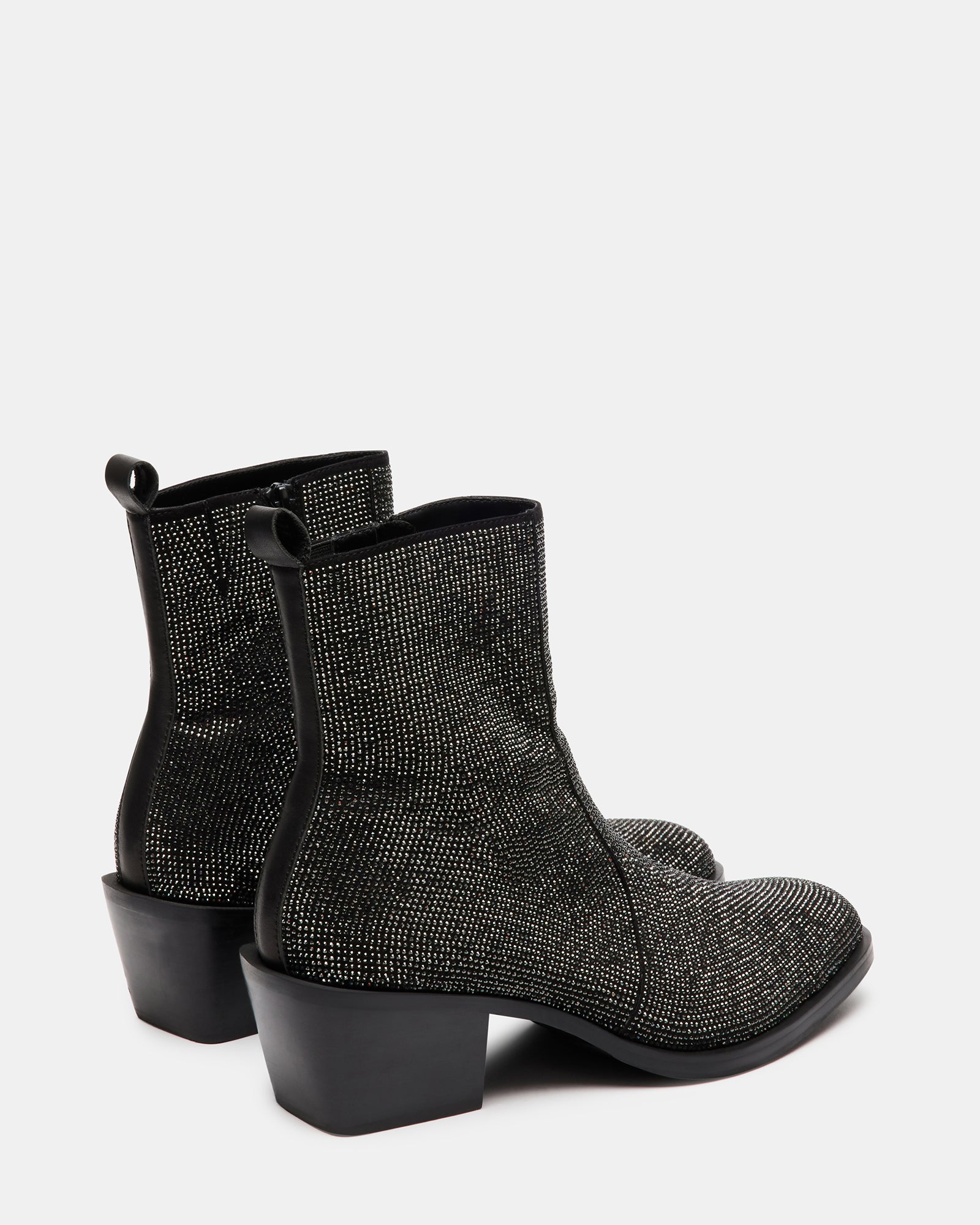Close-up of kitten heel and rhinestone detailing on ankle boots
