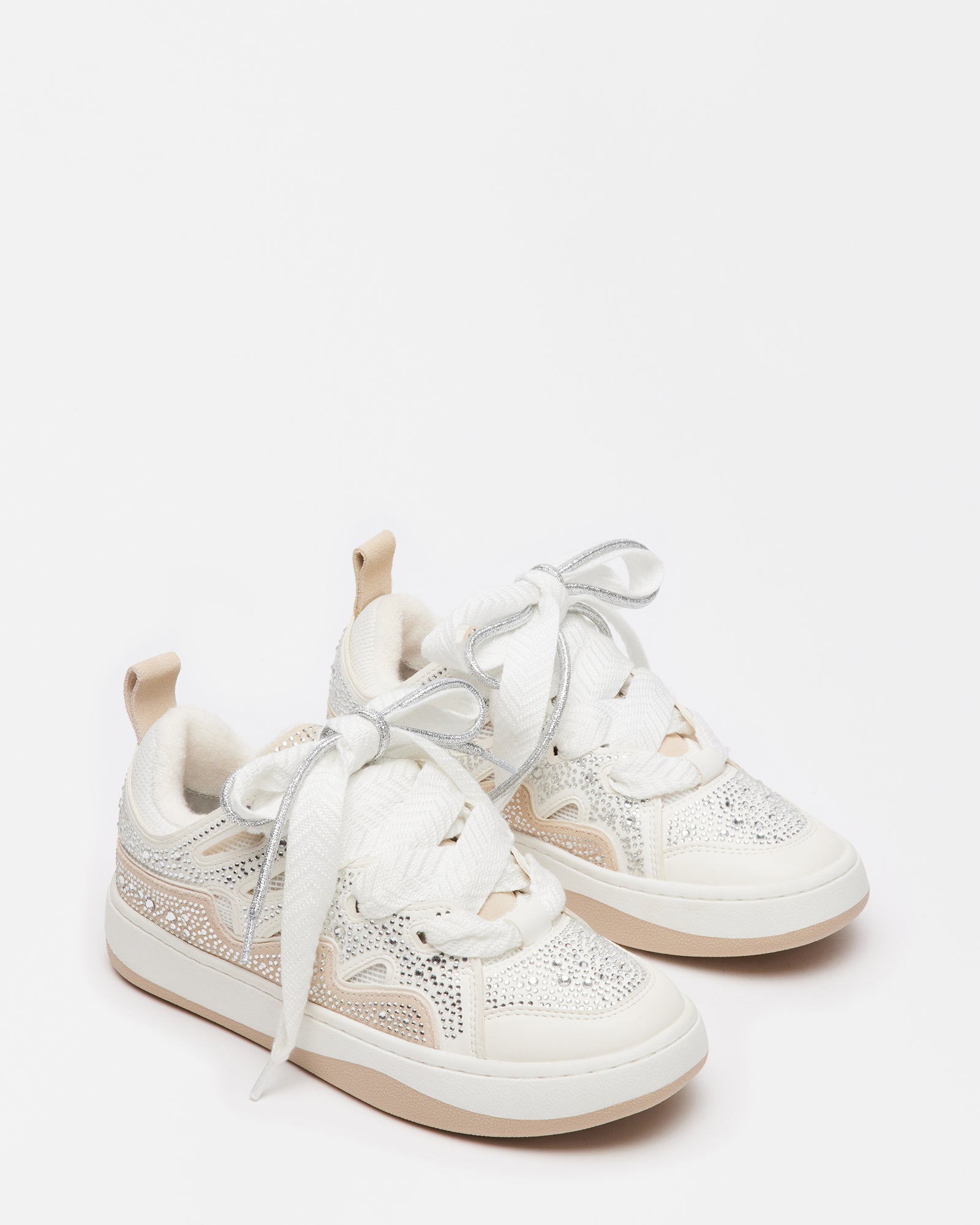 Top-down angle of platform sneakers women wear with layered suede and vegan materials