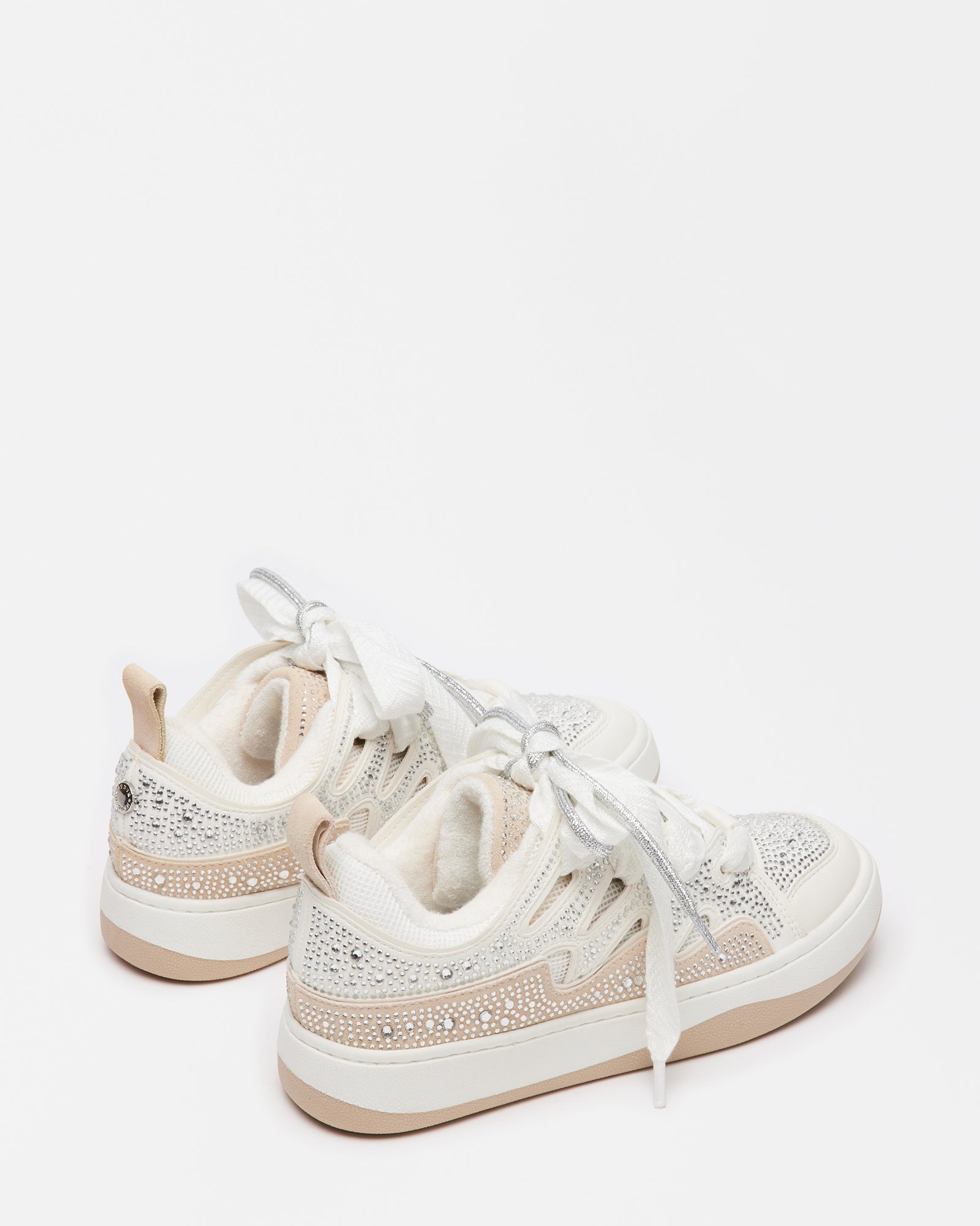 Top-down angle of platform sneakers women wear with layered suede and vegan materials