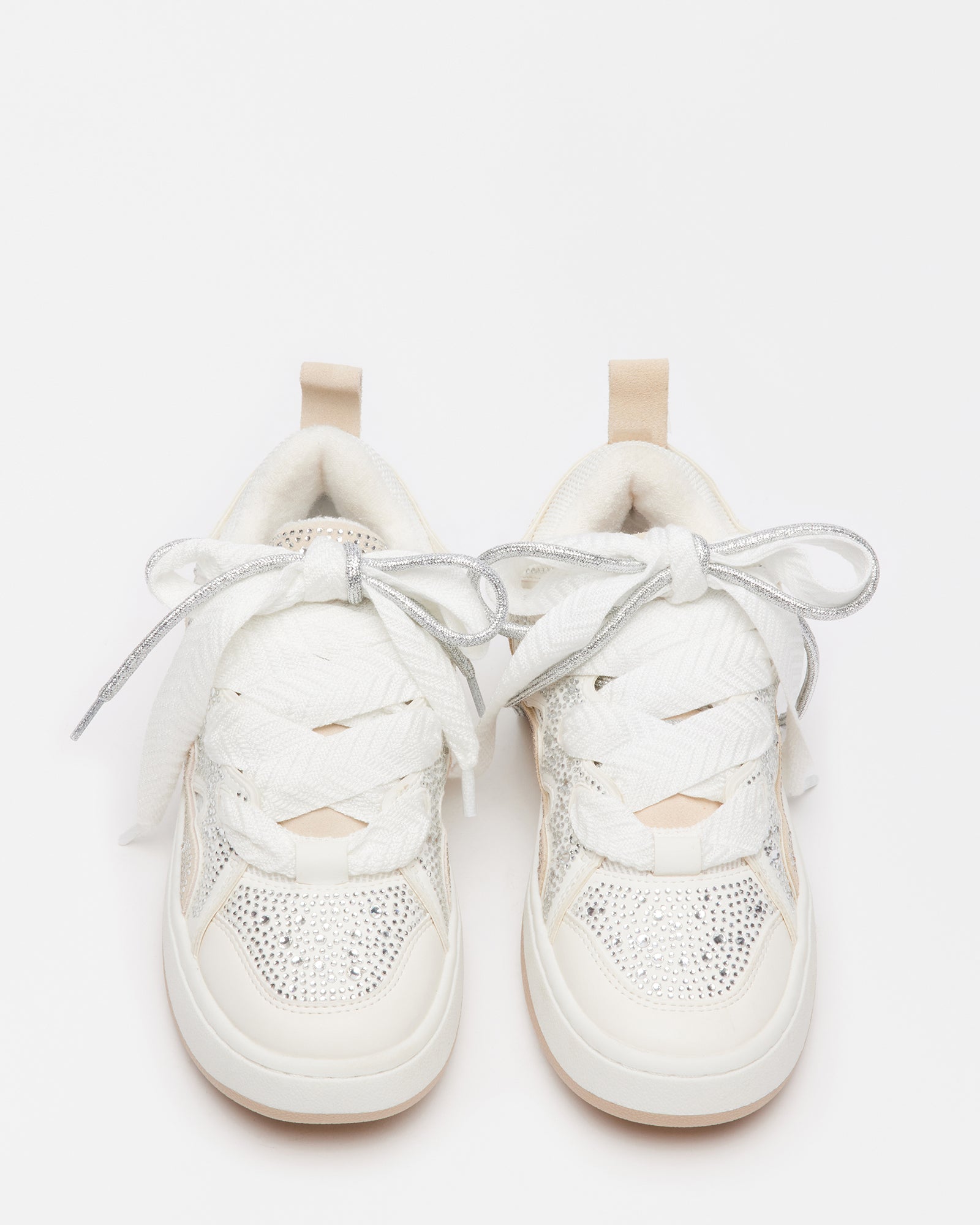 Lifestyle shot of black platform sneakers and white pair styled for a casual NYC street look