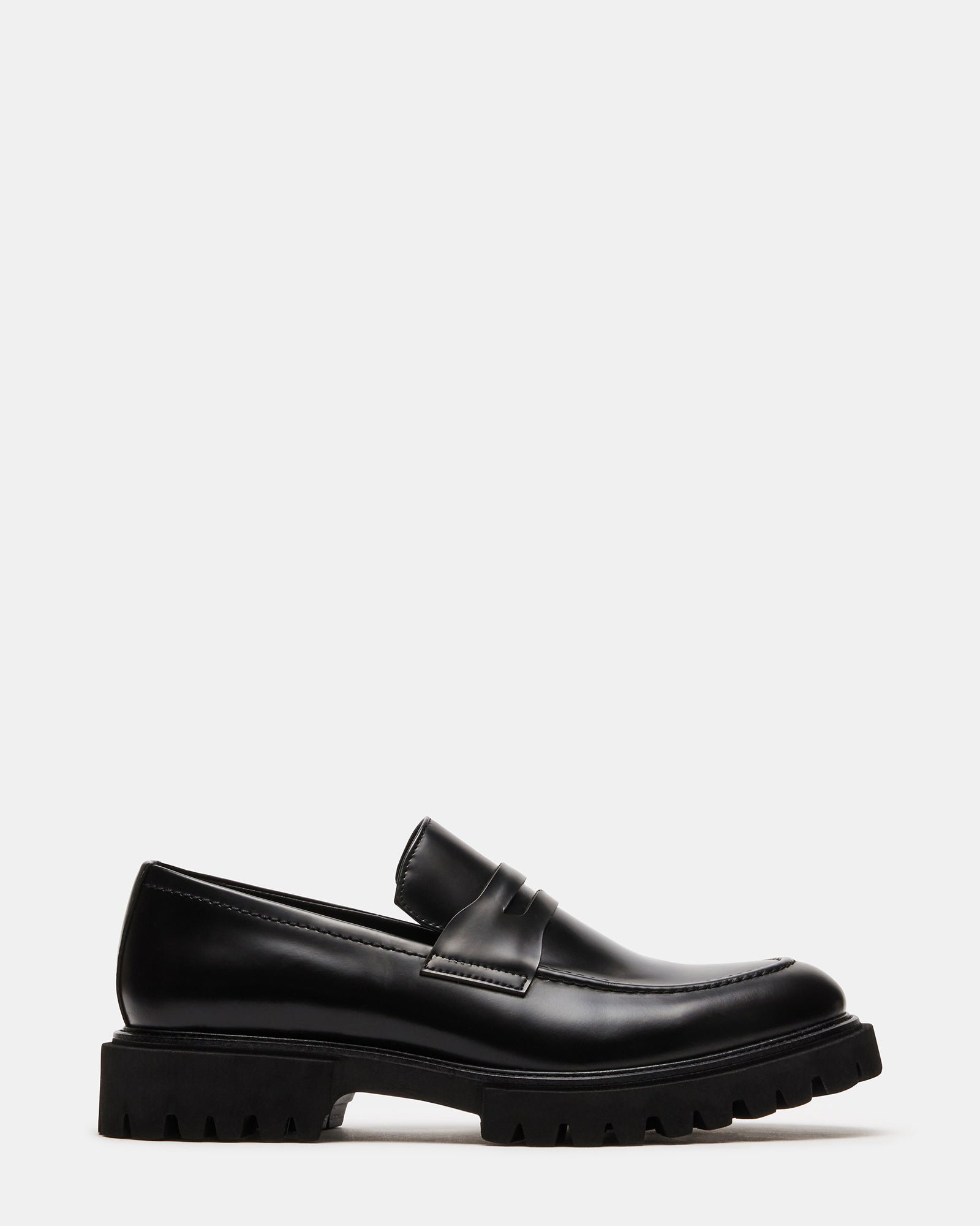 Black leather loafers side view showing stitching detail
