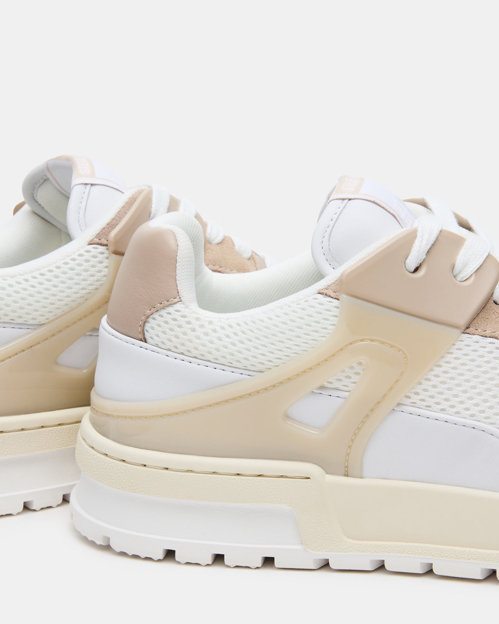 Close-up of rubber sole and white leather details for mens white sneakers