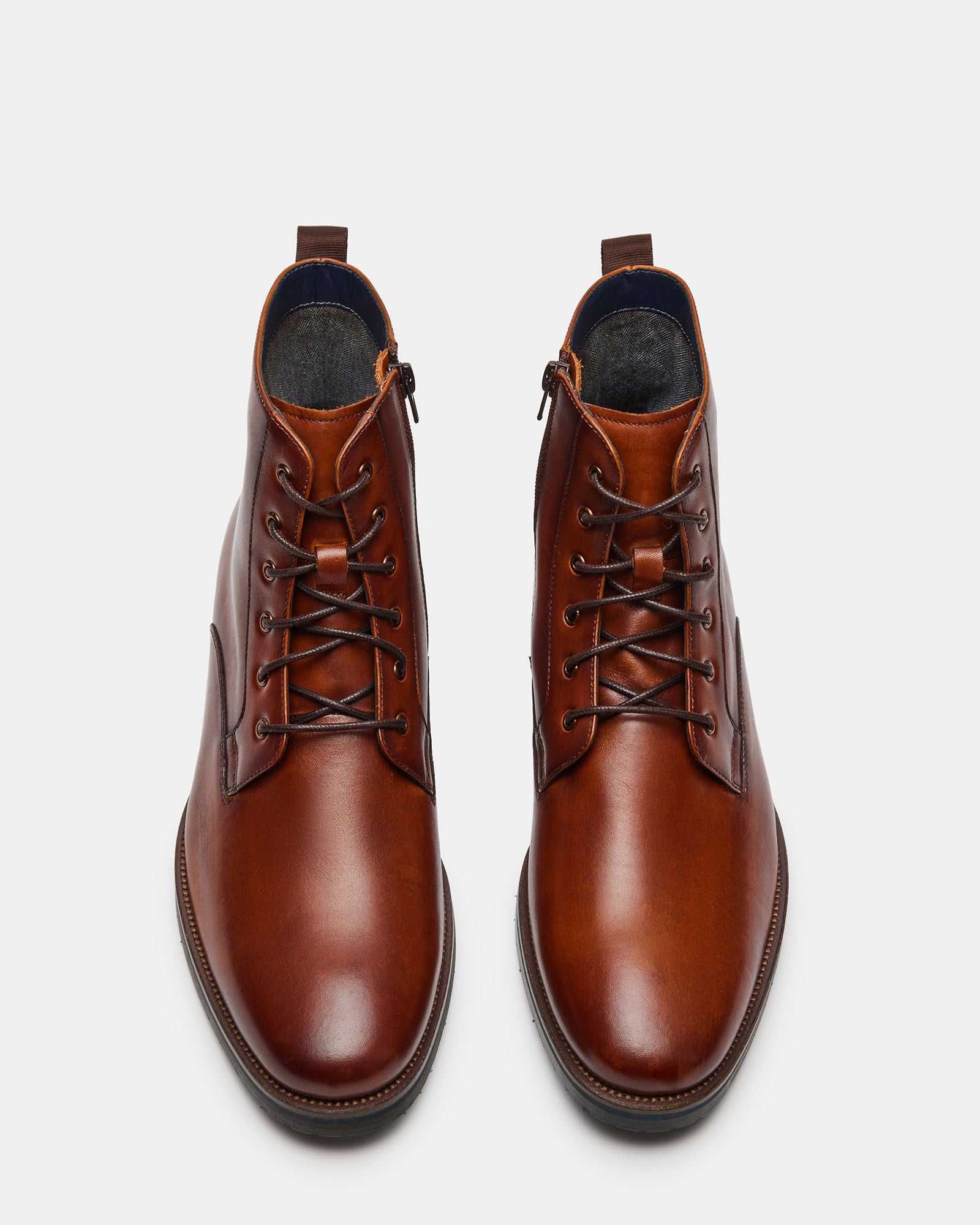 Front view of sleek tan leather combat boots for ladies.