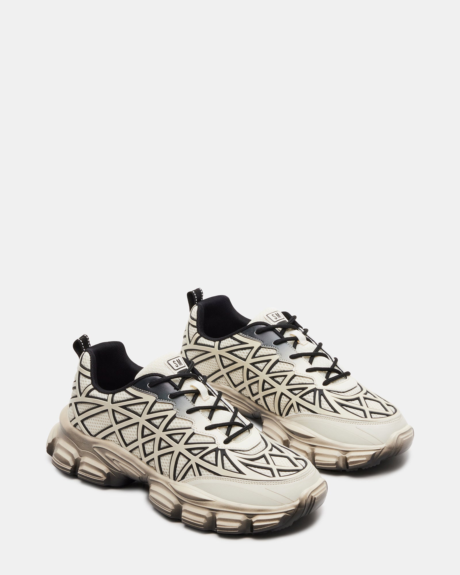 Side profile of sneakers highlighting breathable mesh upper