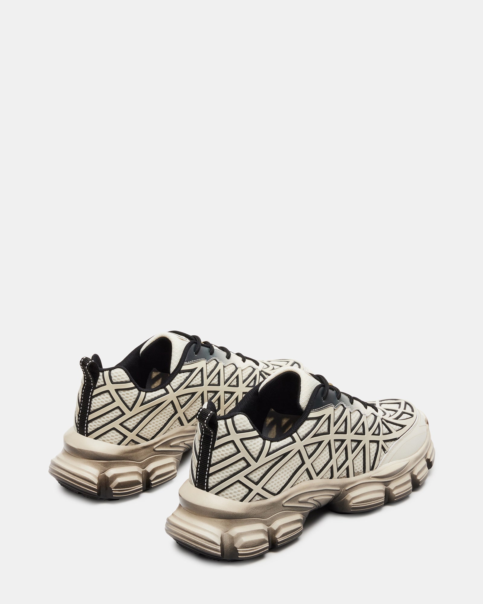 Side profile of sneakers highlighting breathable mesh upper