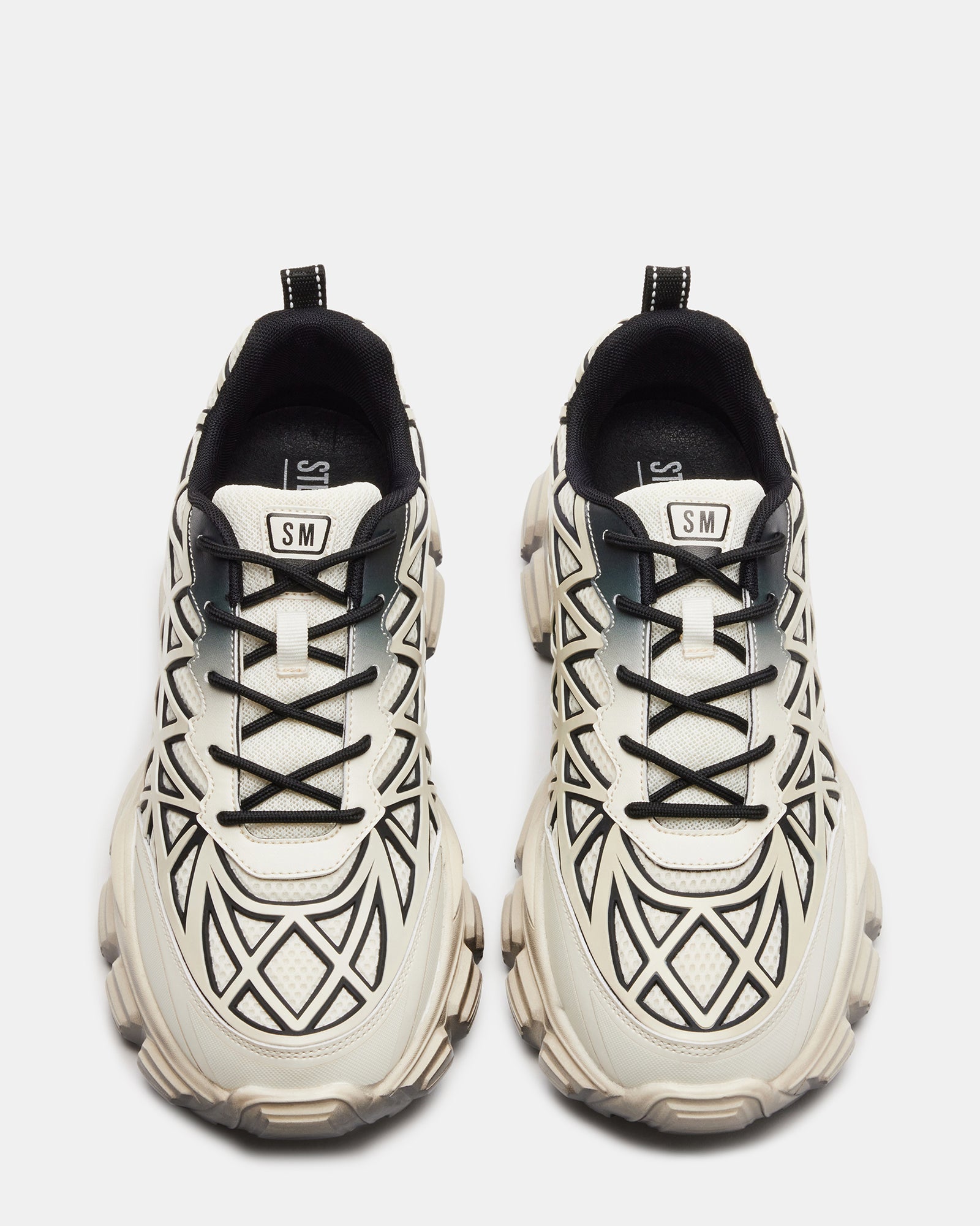 Skidmore White Multi Sneakers on pavement, showcasing lace-up design