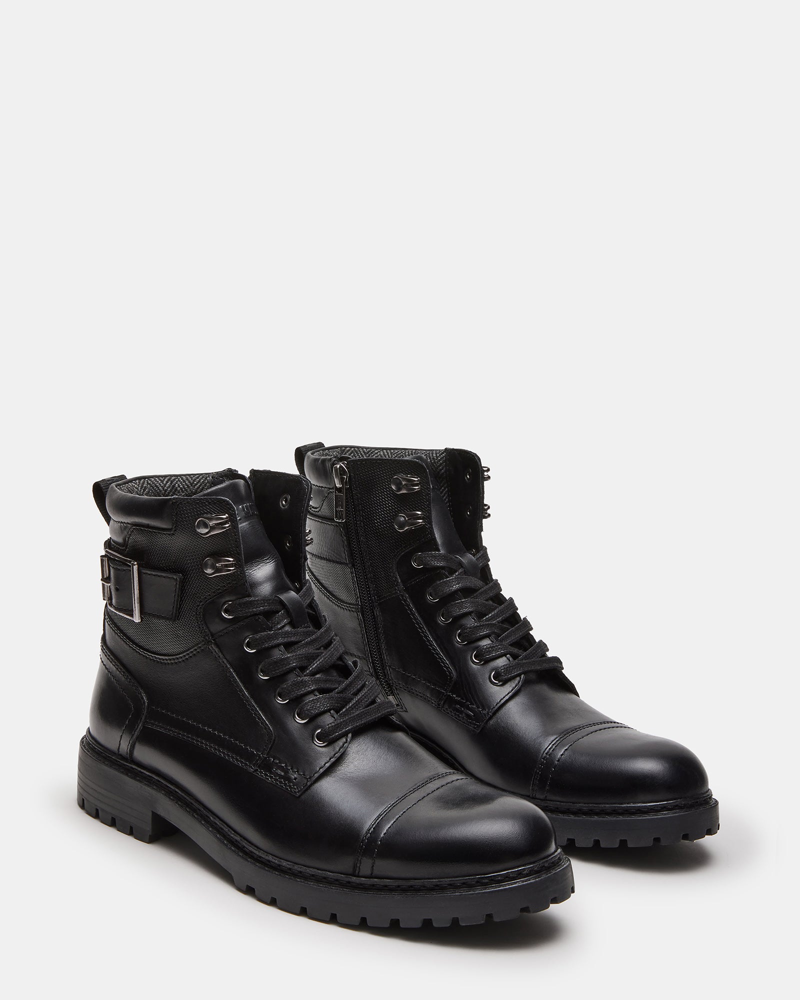 Close-up of brown leather boots showing heel tab and zip feature, great for casual wear