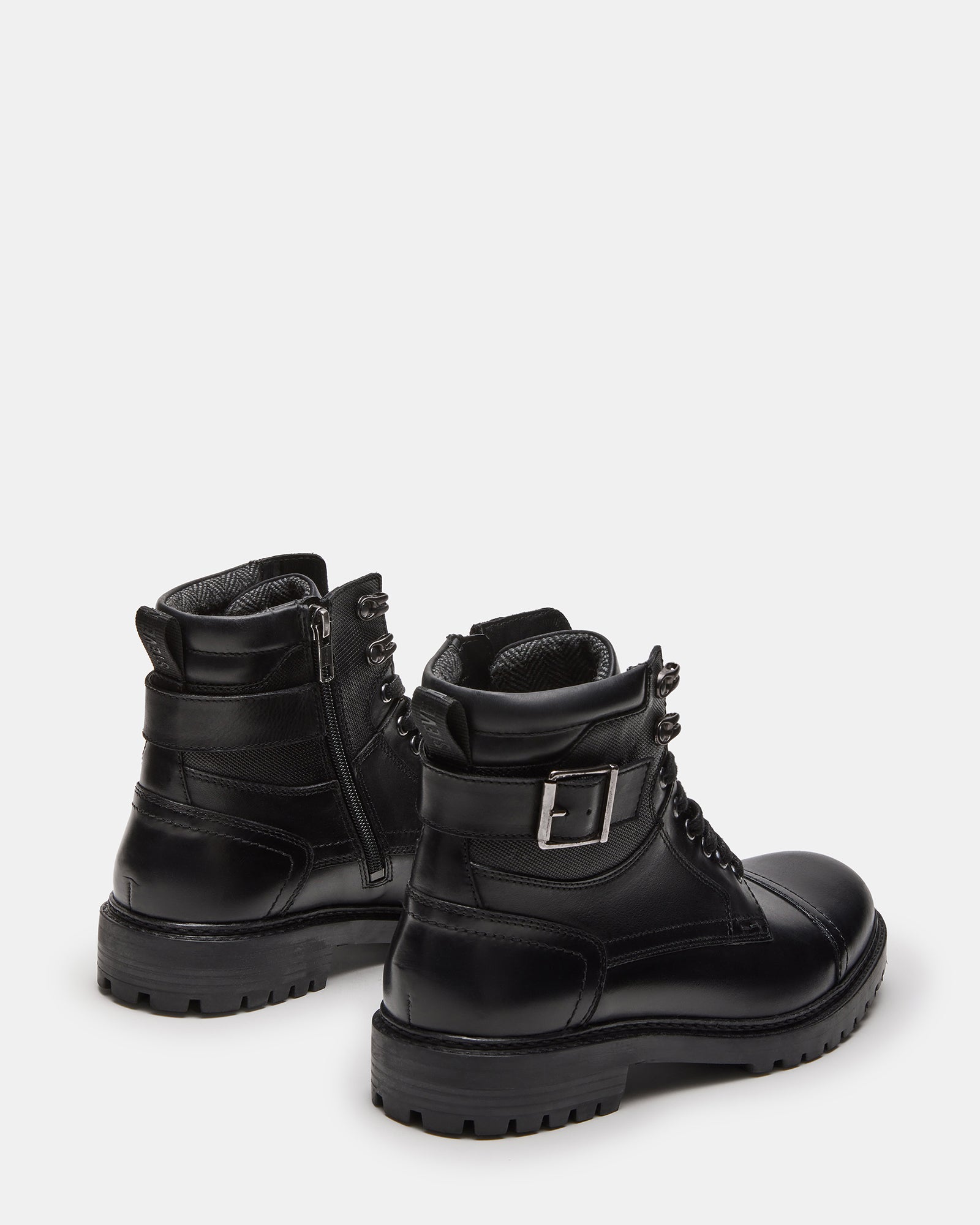Close-up of brown leather boots showing heel tab and zip feature, great for casual wear
